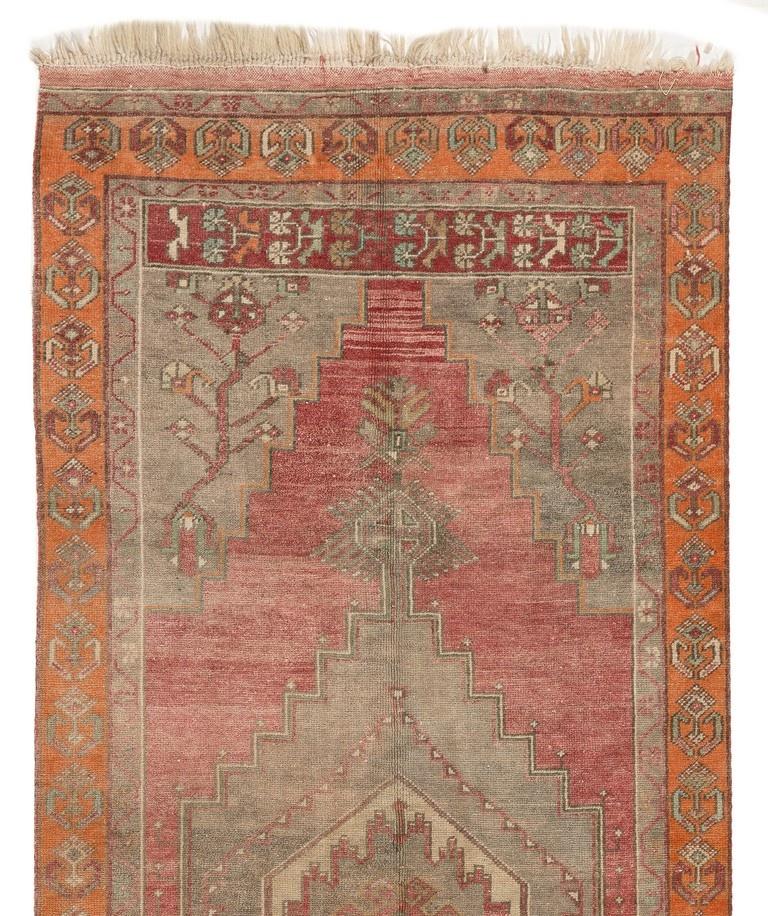 A finely hand-knotted vintage Turkish carpet from 1960s featuring a geometric medallion design. The rug is made of medium wool pile on wool foundation. It is heavy and lays flat on the floor, in very good condition with no issues. It has been washed