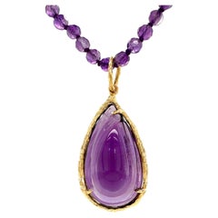 Used 39 Carat Carved Amethyst Pendant in 18K Gold on Convertible Amethyst Bead Chain