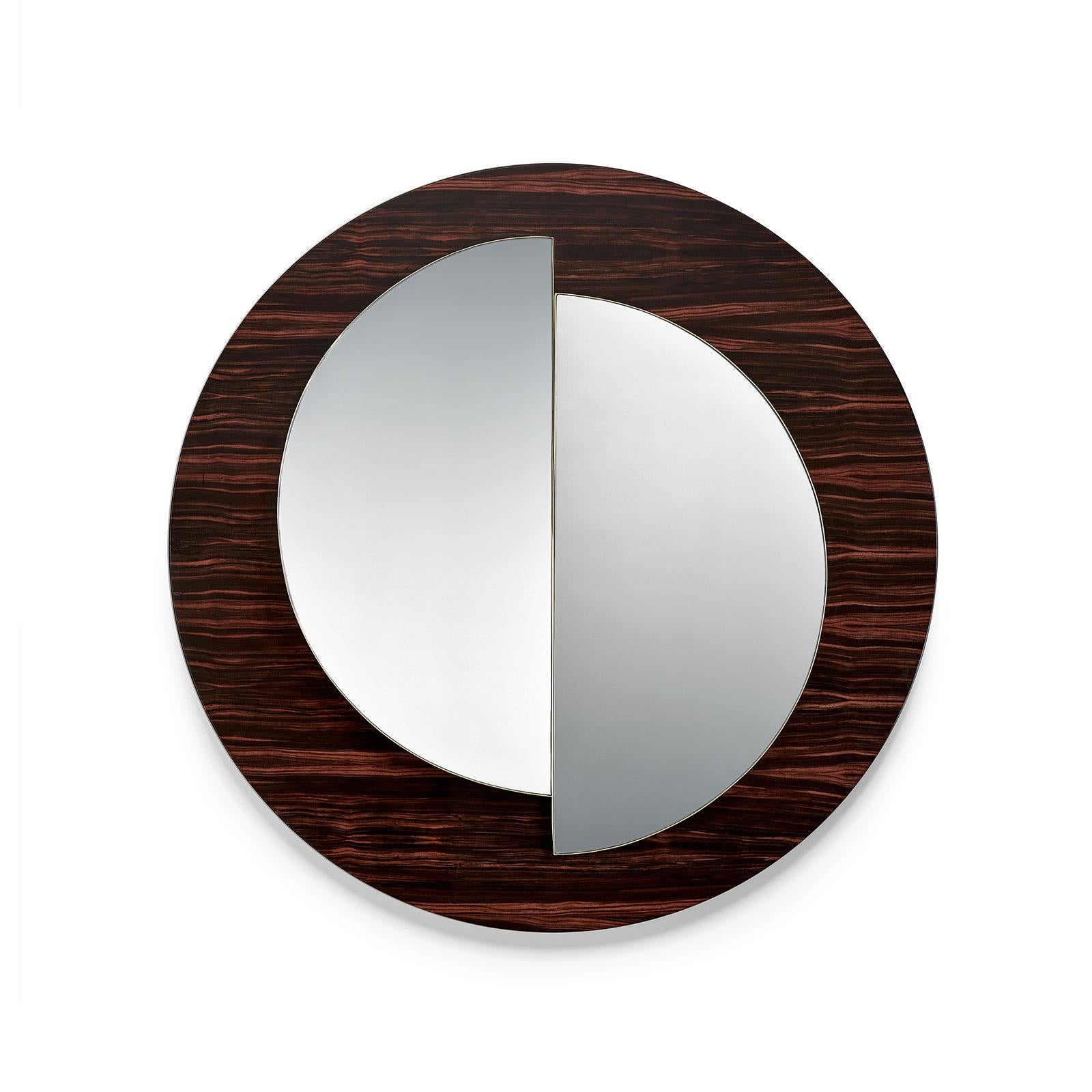 The divided mirrors provide two different reflections, in two different perspectives, as that of night and day, dark and light, the sky and the land.
Frame: Bird Eye, Artic Bird Eye, American Walnut, Ebony or Olive Ash wood veneer with matt or gloss