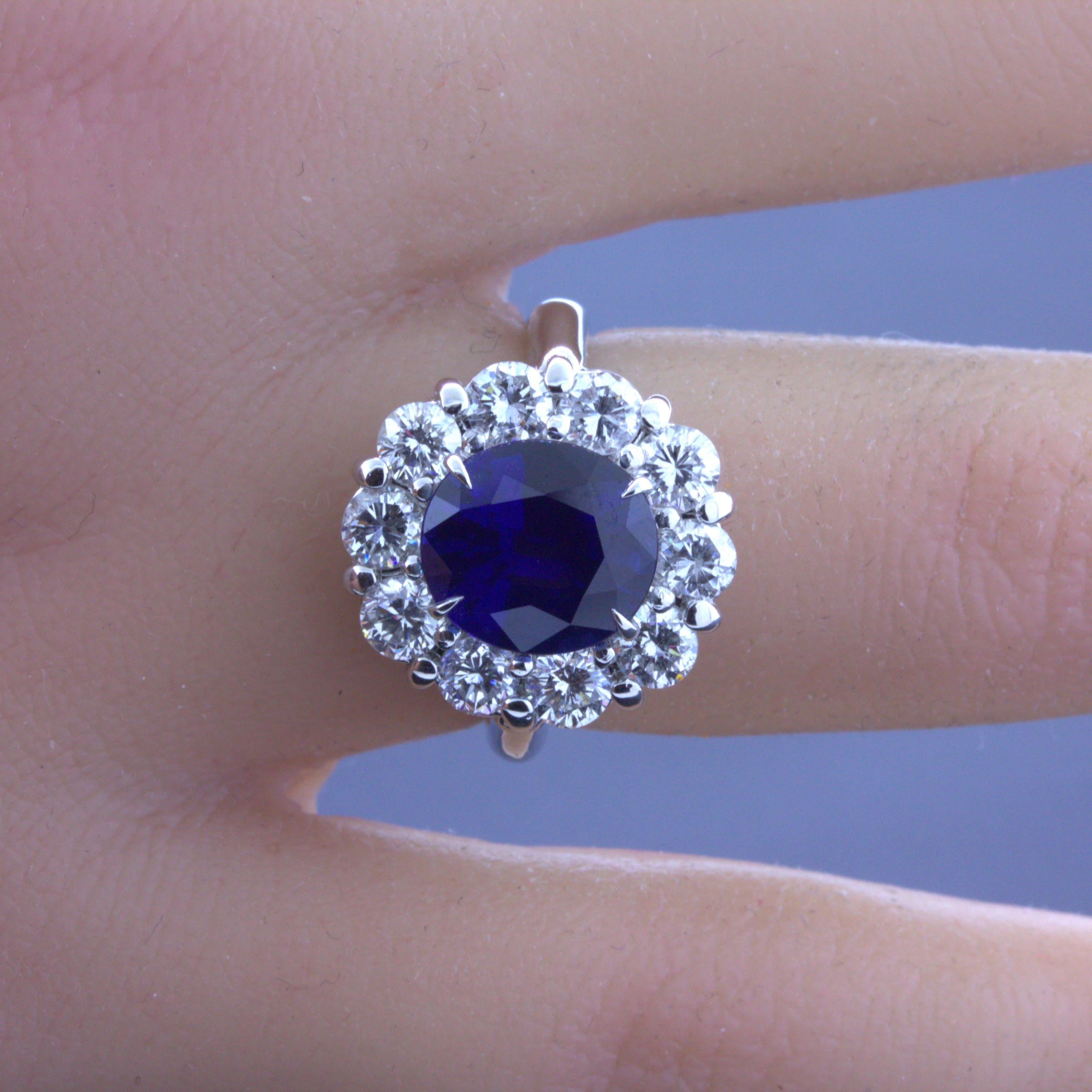 Women's 3.90 Carat Blue Sapphire Diamond Halo Platinum Ring, GIA Certified For Sale