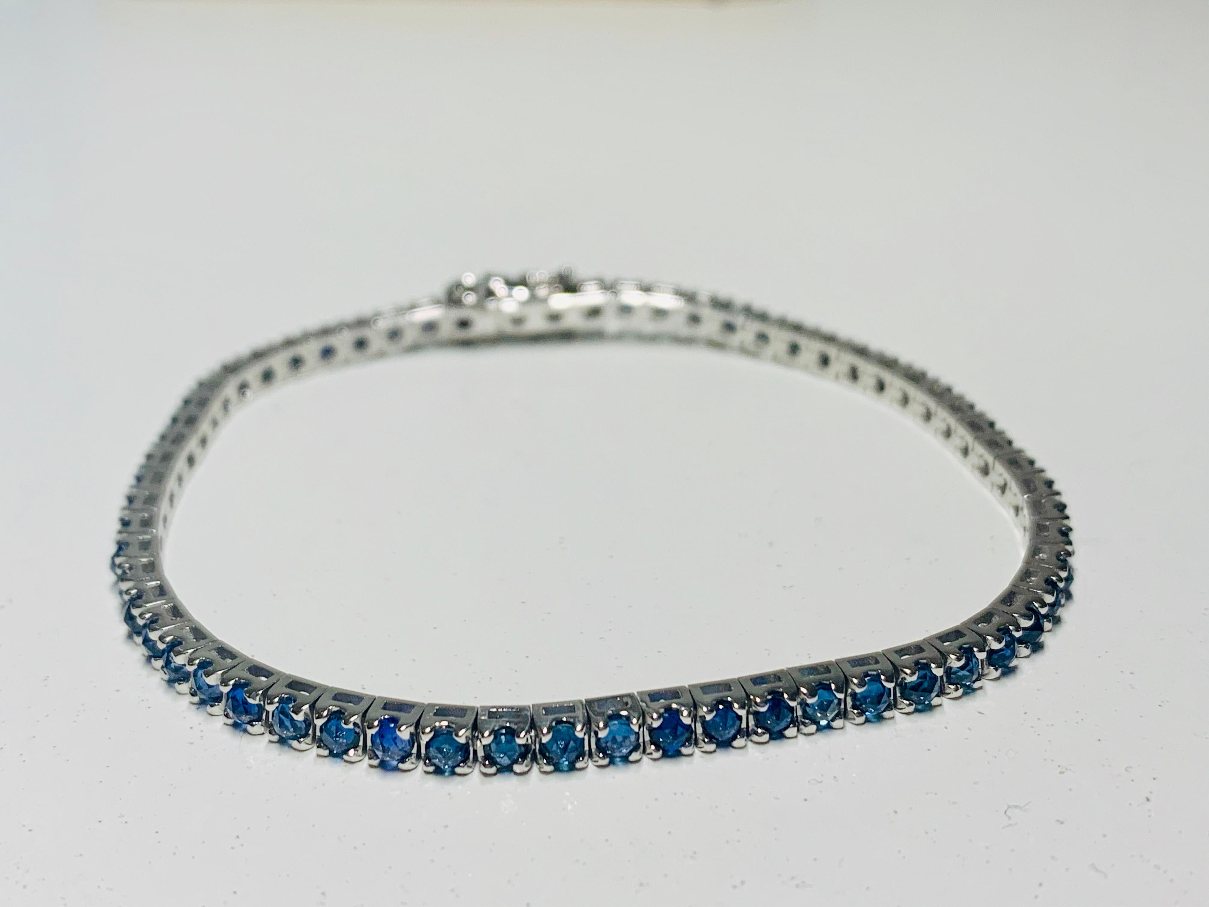 This 3.90 Carat Blue Sapphire & 18Kt White Gold Unisex Tennis Bracelet, suits any attire whatever the occasion or time of day. 

It beautifully sparkles and can be adored alone or worn stacked with other bracelets. 

Unisex it looks equally