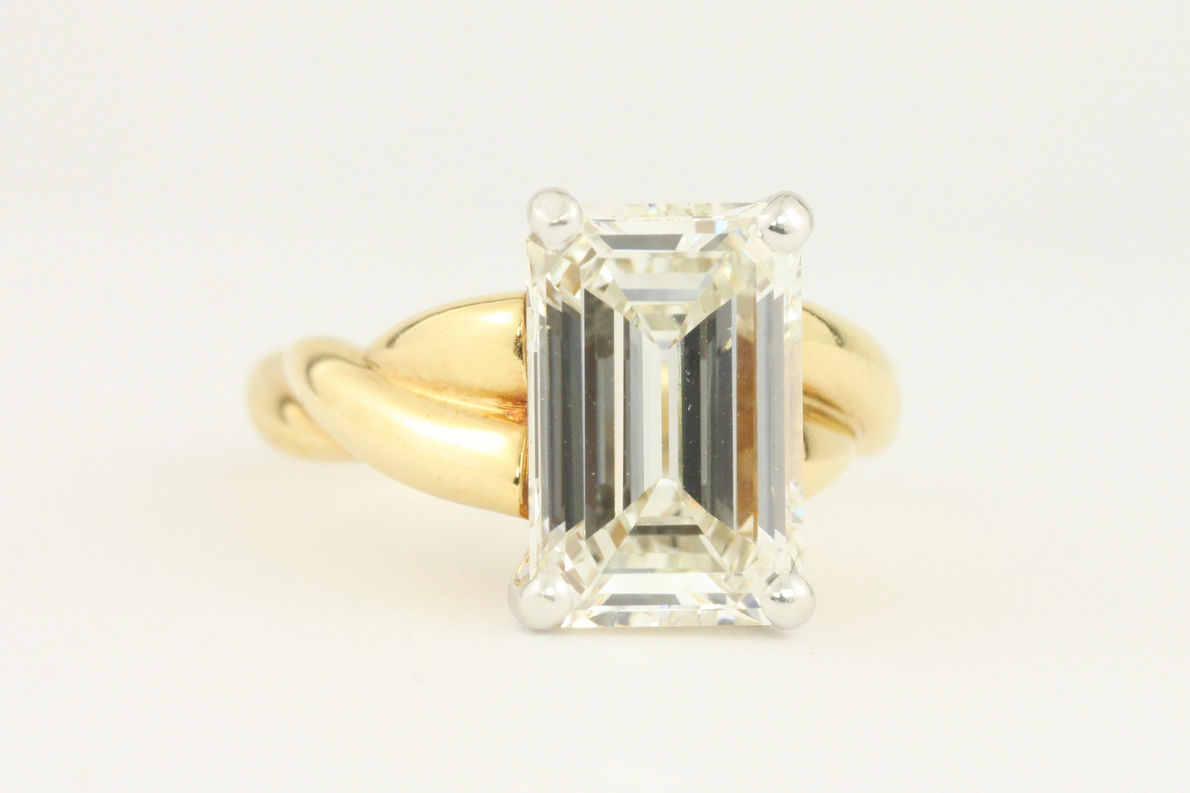 Women's 3.90 Carat Emerald Cut Diamond 18 Karat Yellow Gold and Platinum Engagement Ring For Sale