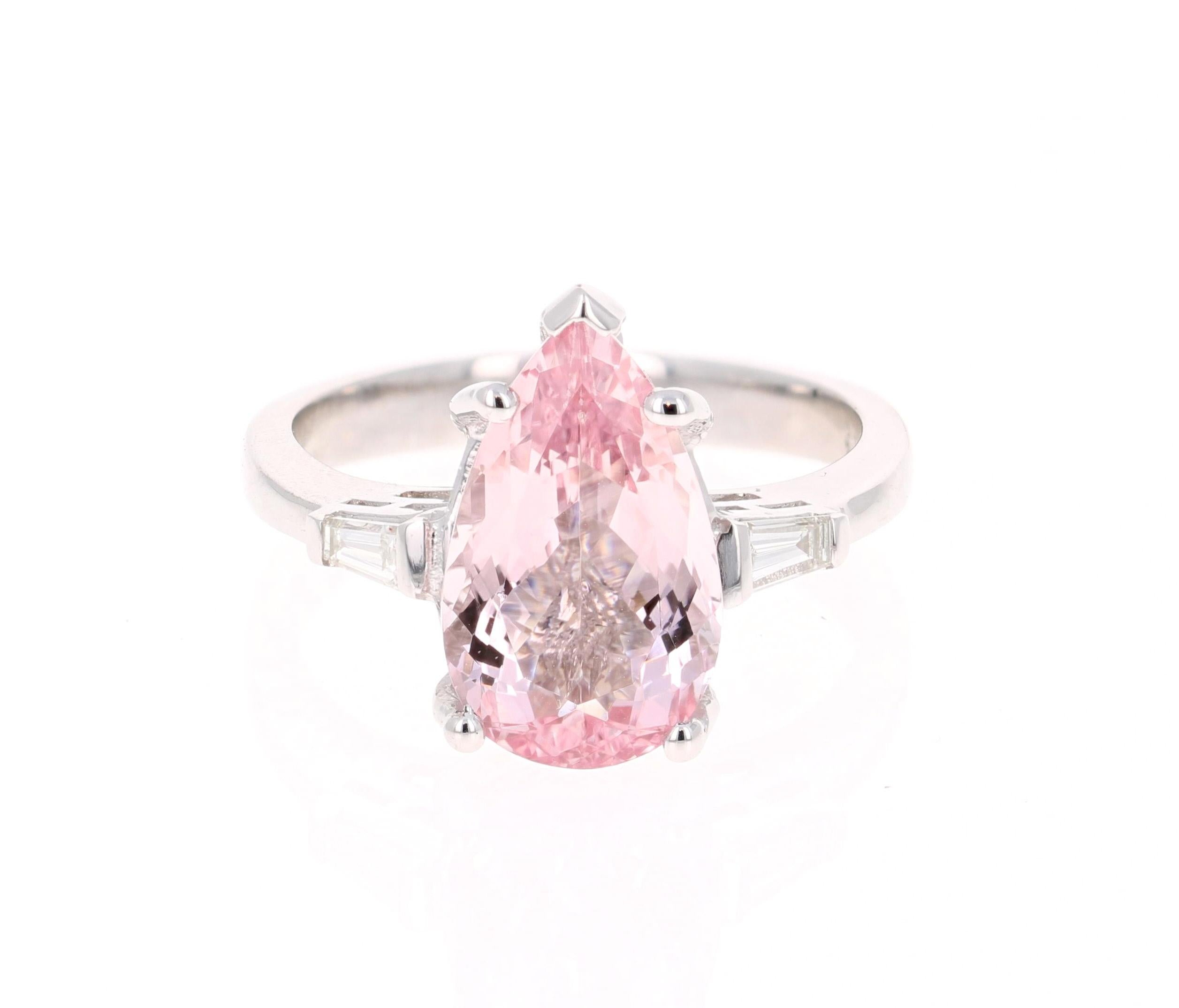 A lovely Engagement Ring Option or as an alternate to a Pink Diamond Ring! 

This gorgeous and classy Morganite and Diamond Ring has a 3.68 Carat Pear Cut Pink Morganite and has 2 Baguette Cut Diamonds that weigh 0.22 carats (Clarity: VS2, Color: