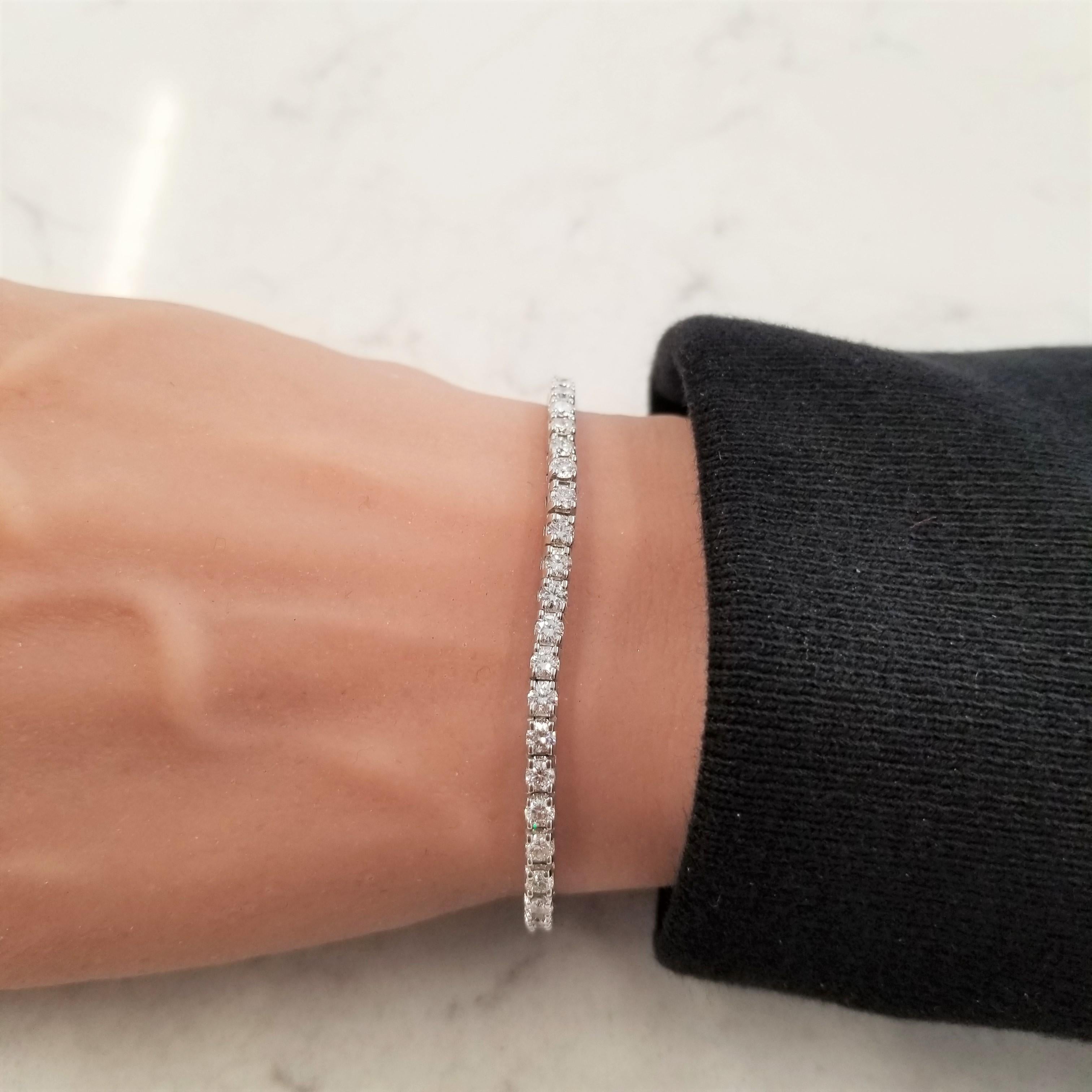 Impress your fans (or nearest acquaintances) with this versatile 3.90 carat, 4 prong set diamond 14K White Gold tennis bracelet. The round brilliants are Near Colorless and SI in purity. You don’t have to be a tennis champ to enjoy this jewelry