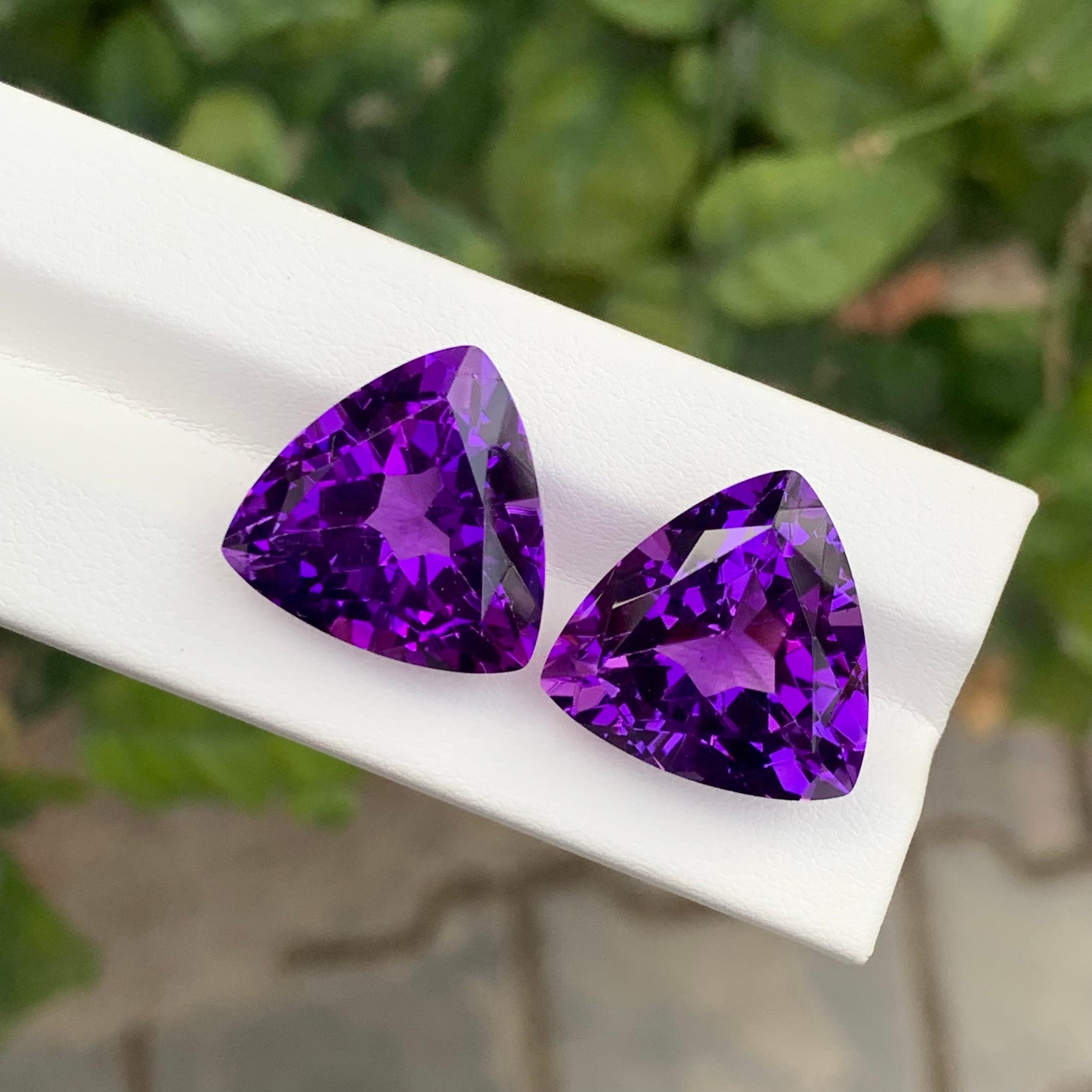 Stone: Amethyst Pair 

Weight : 39.00 Carats
Dimension: 18 x 18 x 12.2 Mm And 
                    18 x 18 x 11.7 Mm 
Origin: Brazil
Shape: Trillion 
Color: Purple
Treatment: Non
Certificate: On Customer Demand

Amethyst, a stunning violet variety