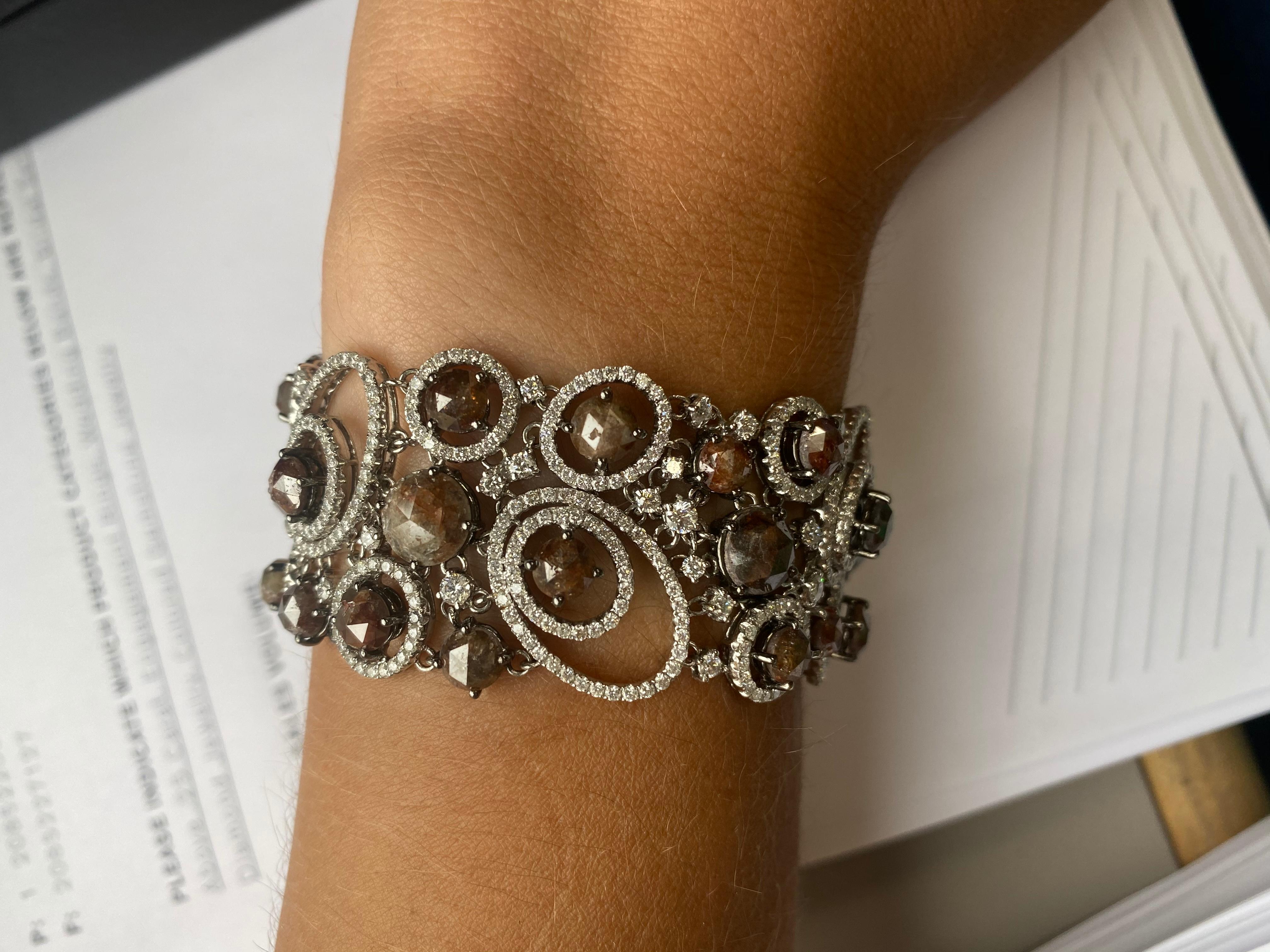 One-of-a-kind diamond bracelet designed by Diana M. Jewels, features 39.00 Carats of diamonds. 

Description
Virtuosic diamond bracelet
White gold bracelet with round brilliant and rough cut diamonds.
Length: 7