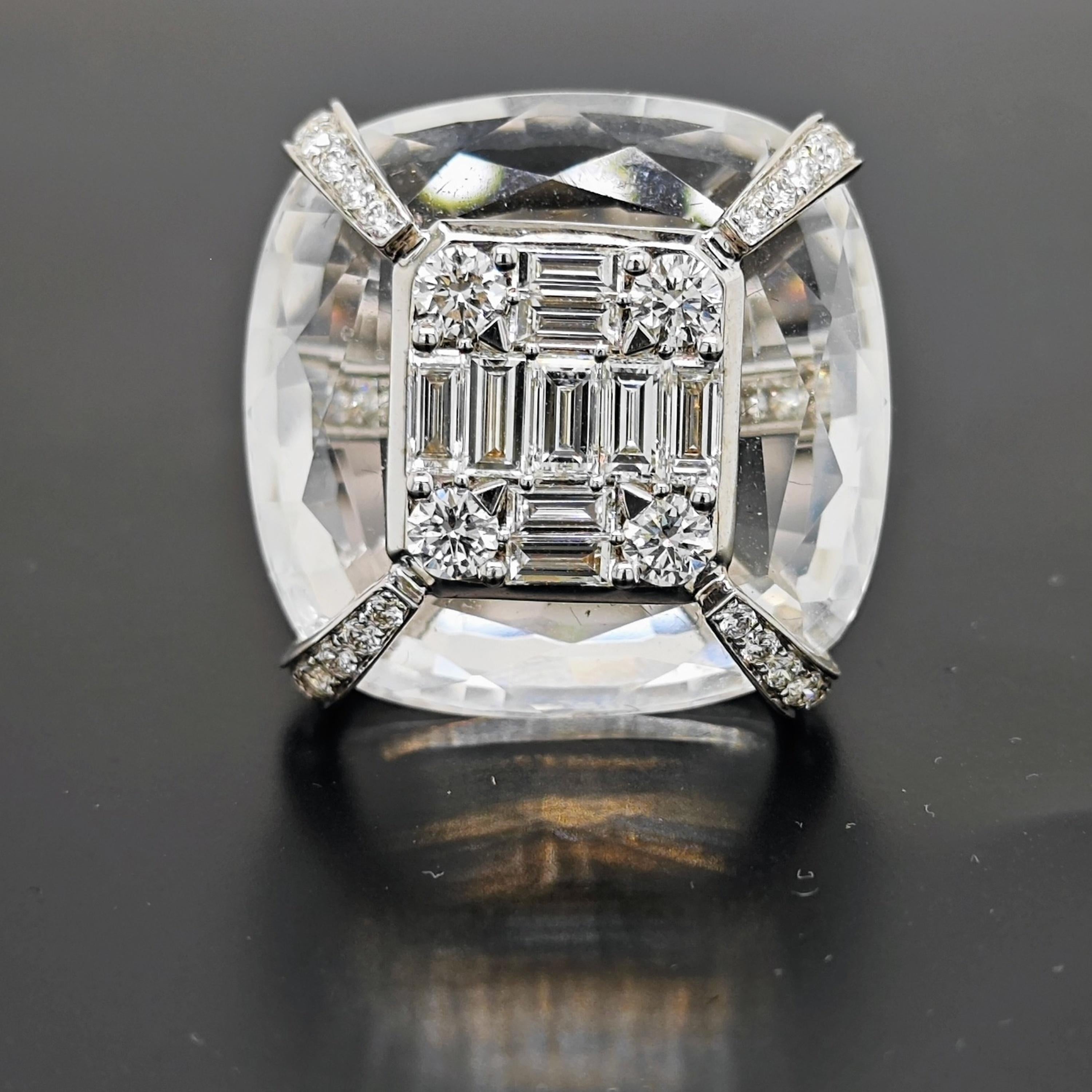 50 White Round Diamonds: 0.78 Carats
9 White Baguette Diamonds: 1.08 Carats
1 Cushion Cut Crystal: 37.19 Carats
Metal: 18K White Gold, 7.11 Grams
