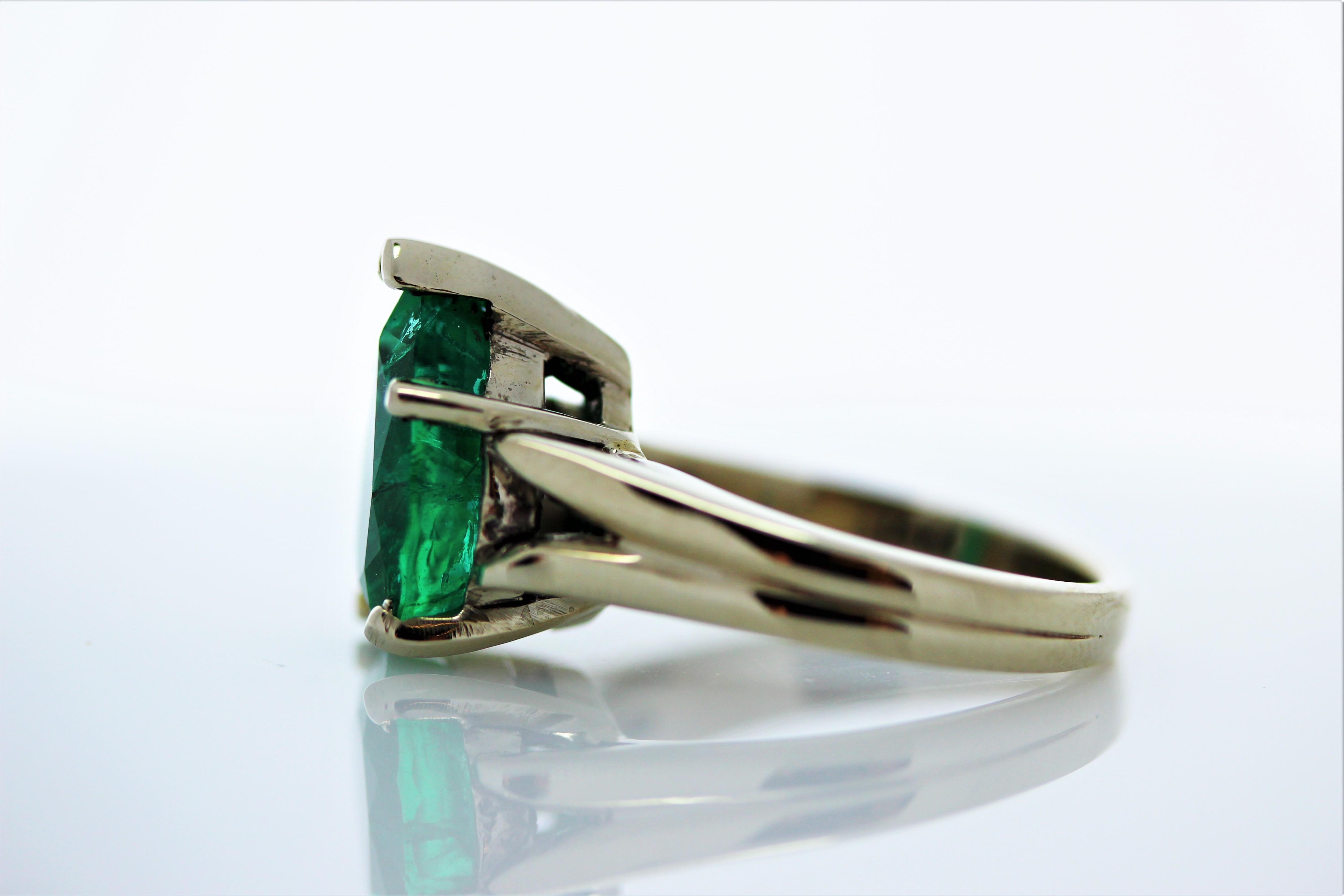 Would you look at this beauty! Simple in design, but there is nothing ordinary about the gorgeous color of this breathtaking green emerald ring. This stunning piece features a pear shape cut 3.90 carats emerald, set into a four-prong. The emerald is