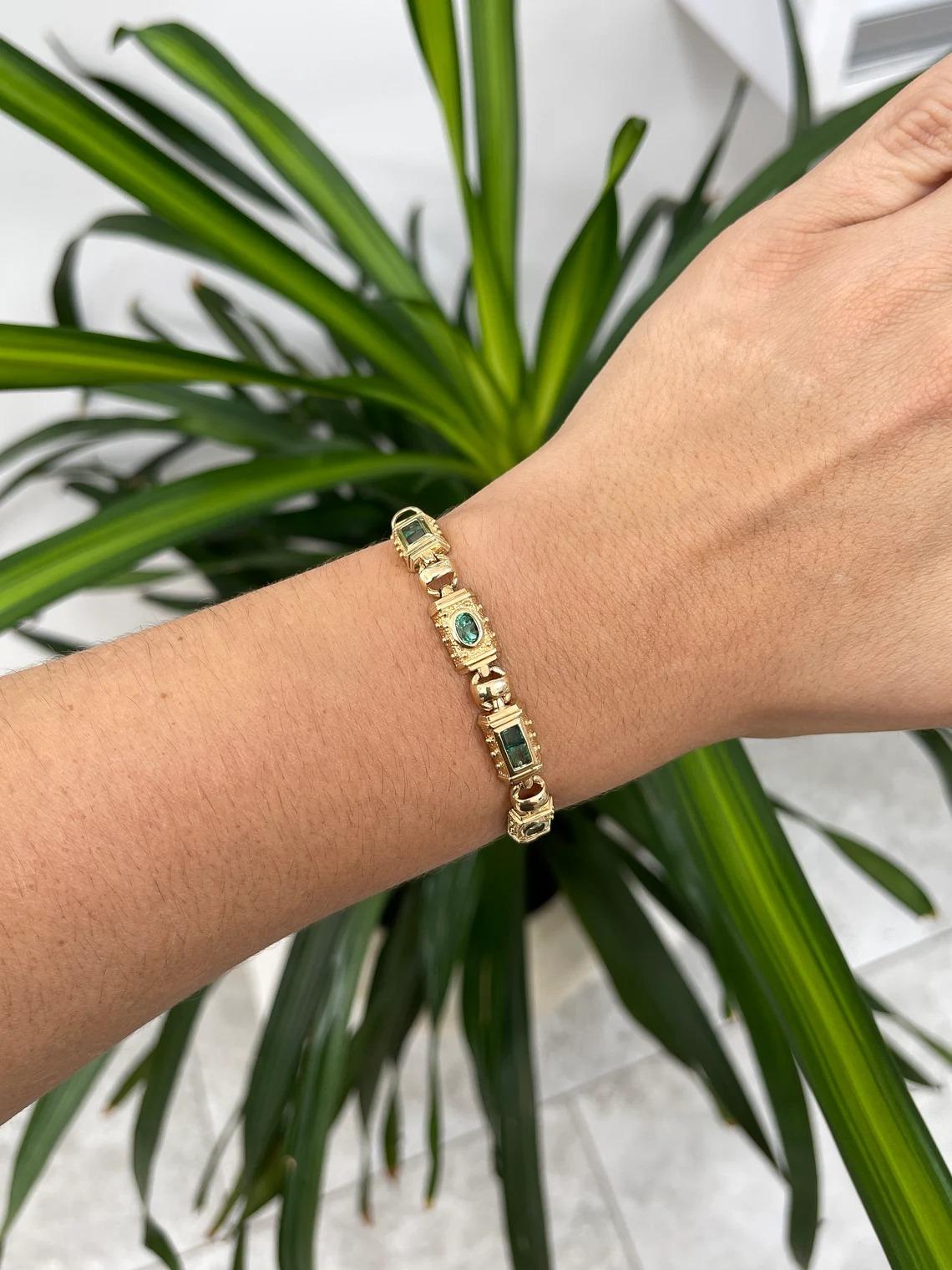 A stunning natural emerald bracelet. This one-of-a-kind piece features a total of 10 gems, four oval cut emeralds and six Asscher cut emeralds put together to create this masterpiece. Carefully crafted and bezel set in gleaming 14K yellow
