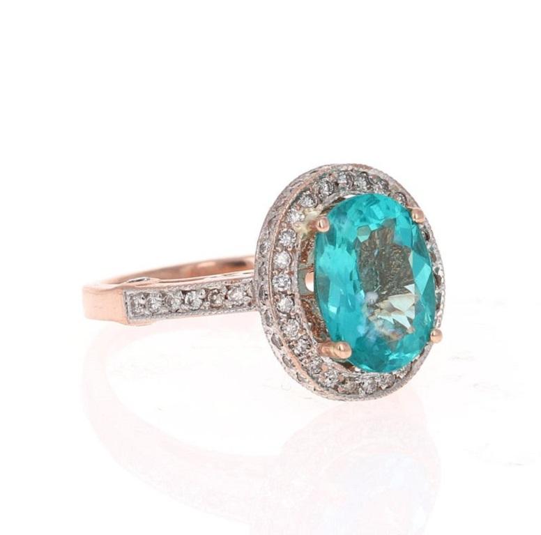 This ring has a gorgeous sea-blue Oval Cut 3.21 Carat Apatite and is surrounded by 82 Round Cut Diamonds weighing 0.70 Carats (Clarity: VS2, Color: H). The total carat weight of the ring is 3.91 Carats. 

Apatites are found in various places around
