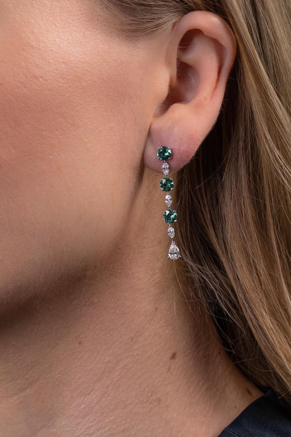 Fun, modern, and bold drop earrings featuring exquisite green tourmaline and marquise and pear-shaped diamonds.  Set in 18k white gold.
(Approx. 1.43 carats of diamonds and 2.48 carats of green tourmalines)