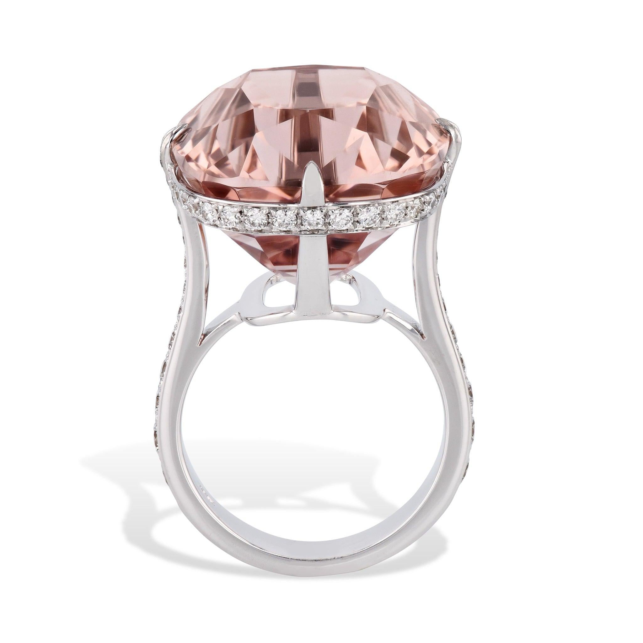 Marvel at the breathtaking beauty of this stunning 18kt. white gold Cushion Cut Morganite Diamond White Gold Ring! As a centerpiece, it holds a 39.18 carat cushion cut Morganite, gracefully accompanied by diamond pave. A must-have size 8.25 handmade