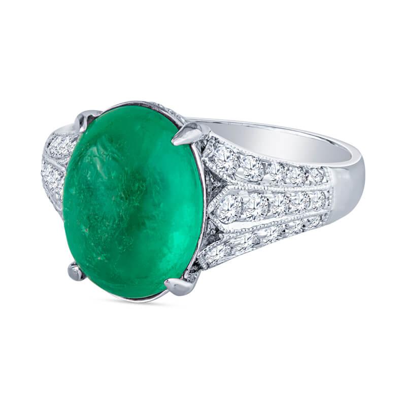 This ring features a 3.92 carat cabochon emerald surrounded by 0.35 carat total weight in round brilliant cut diamonds set in 18 karat white gold. This ring is accented with filigree detailing. It is a size 6 but can be resized upon request.