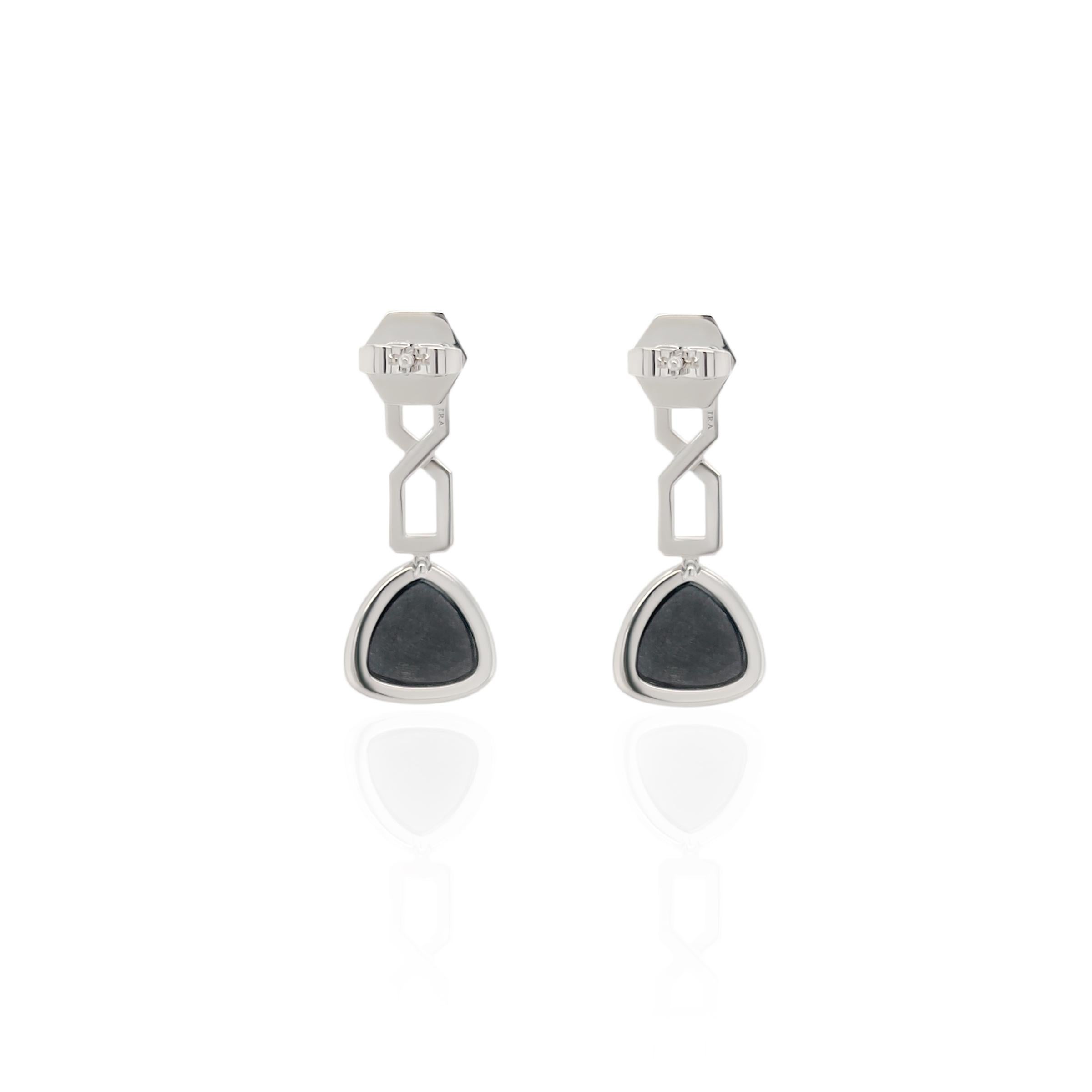 These exquisite 3.93ct trillion cut black onyx and white diamond earrings are stunning and perfect for any occasion. Crafted from 18k white gold and set with black onyx and white diamonds these earrings exude timeless elegance. The faceted black