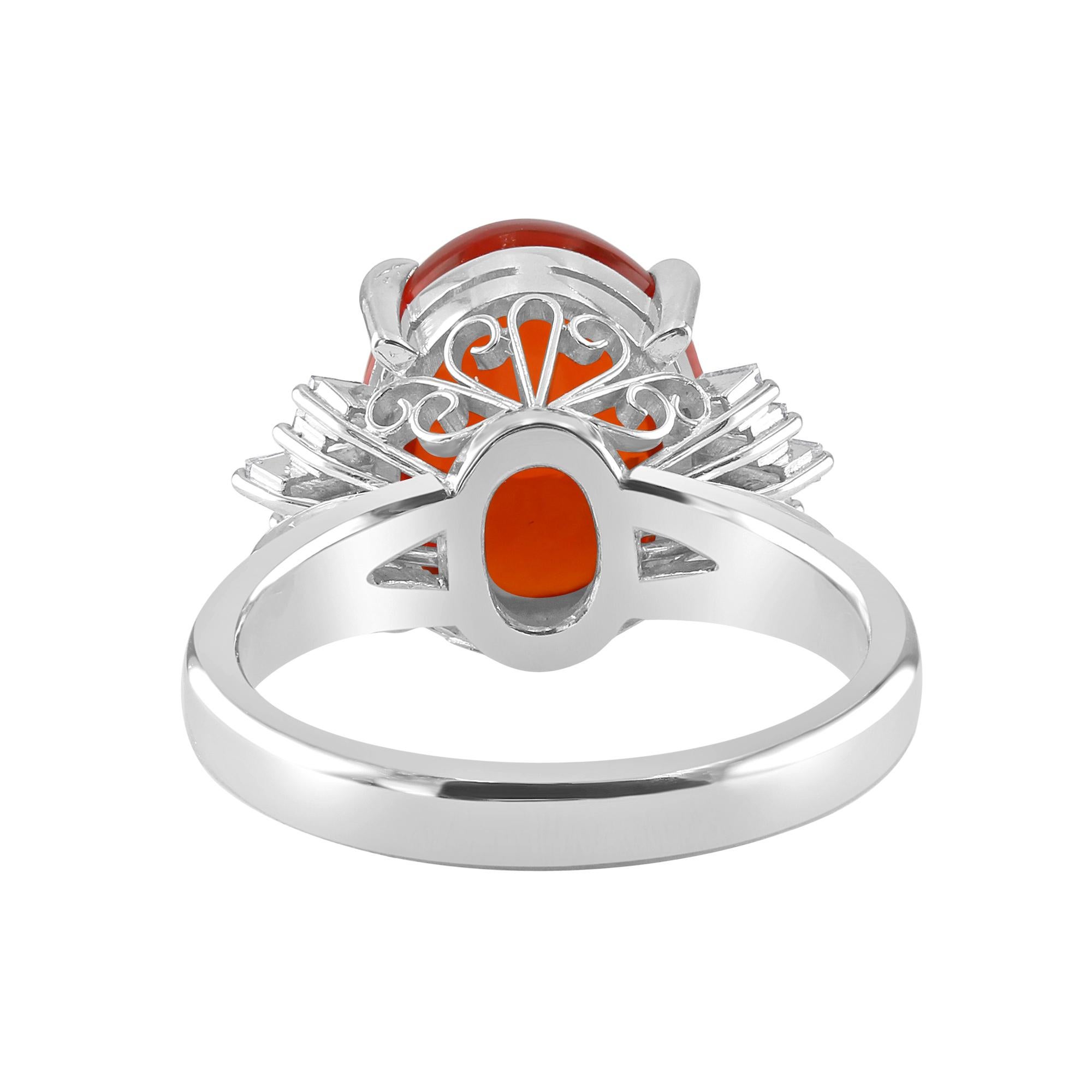 3.92 ct of Fine Mexican Opal, set with 0.28 ct of tapered baguettes and diamonds. 

With its exquisite detail and color, this cocktail fire opal ring is sure to turn heads at any occasion. Fun, classy and beautiful one-of-a-kind accessory. 

Set in