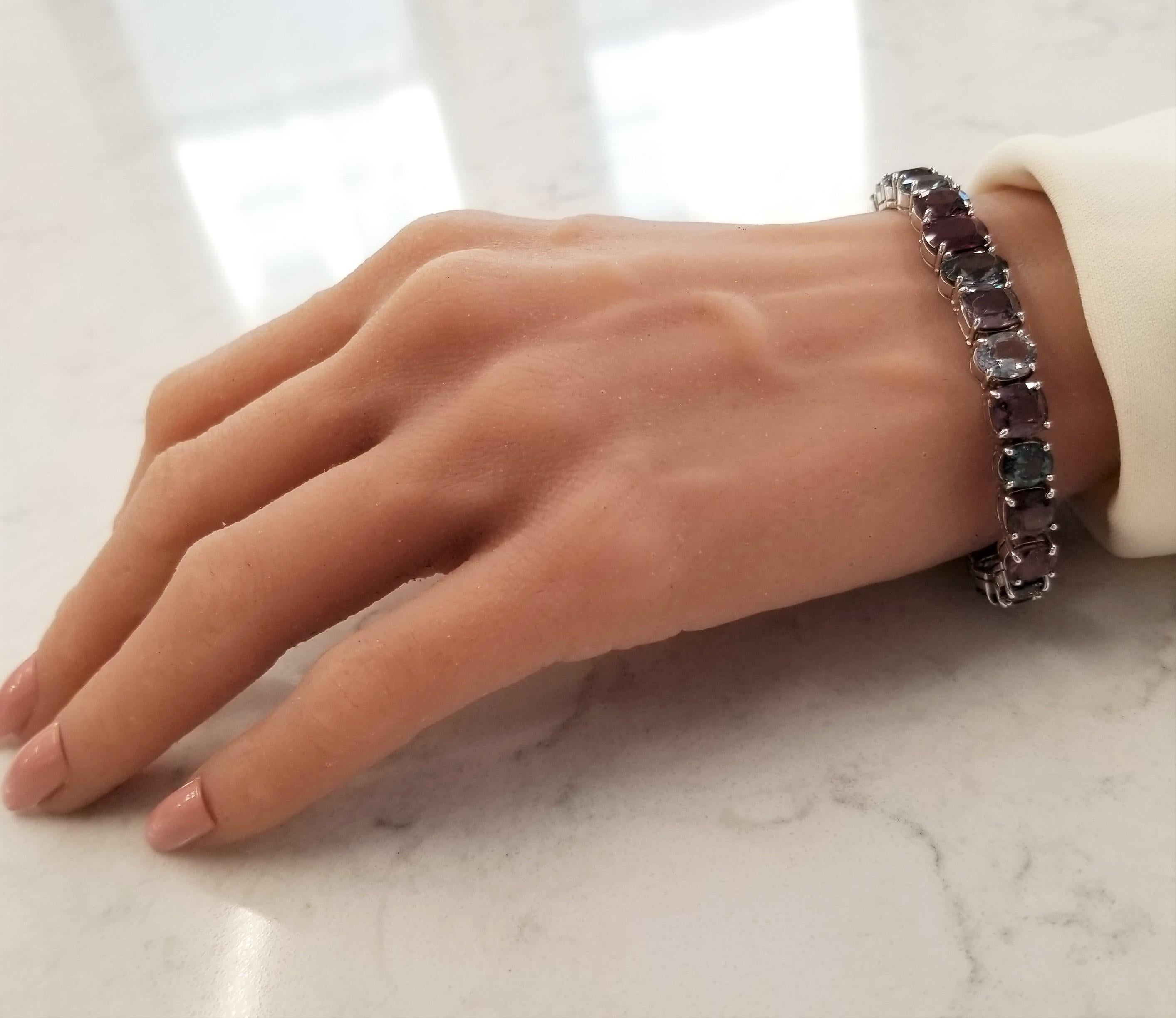 There can only be one of these gem bracelets. The gems are berry-colored natural spinel. The gem source is Sri Lanka; the luster and transparency is what you want; 39.20 carats of multi-colored raspberry and blueberry spinels make up this straight