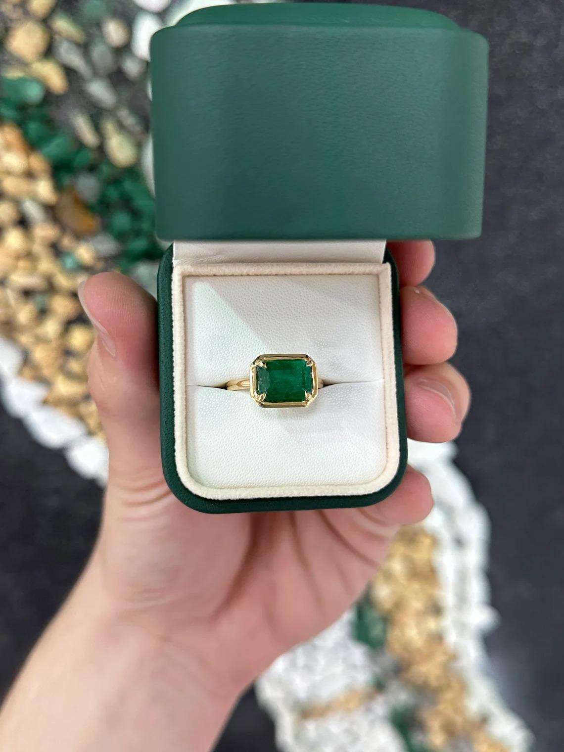 Modern 3.92ct 18K Forest Green Emerald Cut Emerald East to West Solitaire Gold Ring For Sale