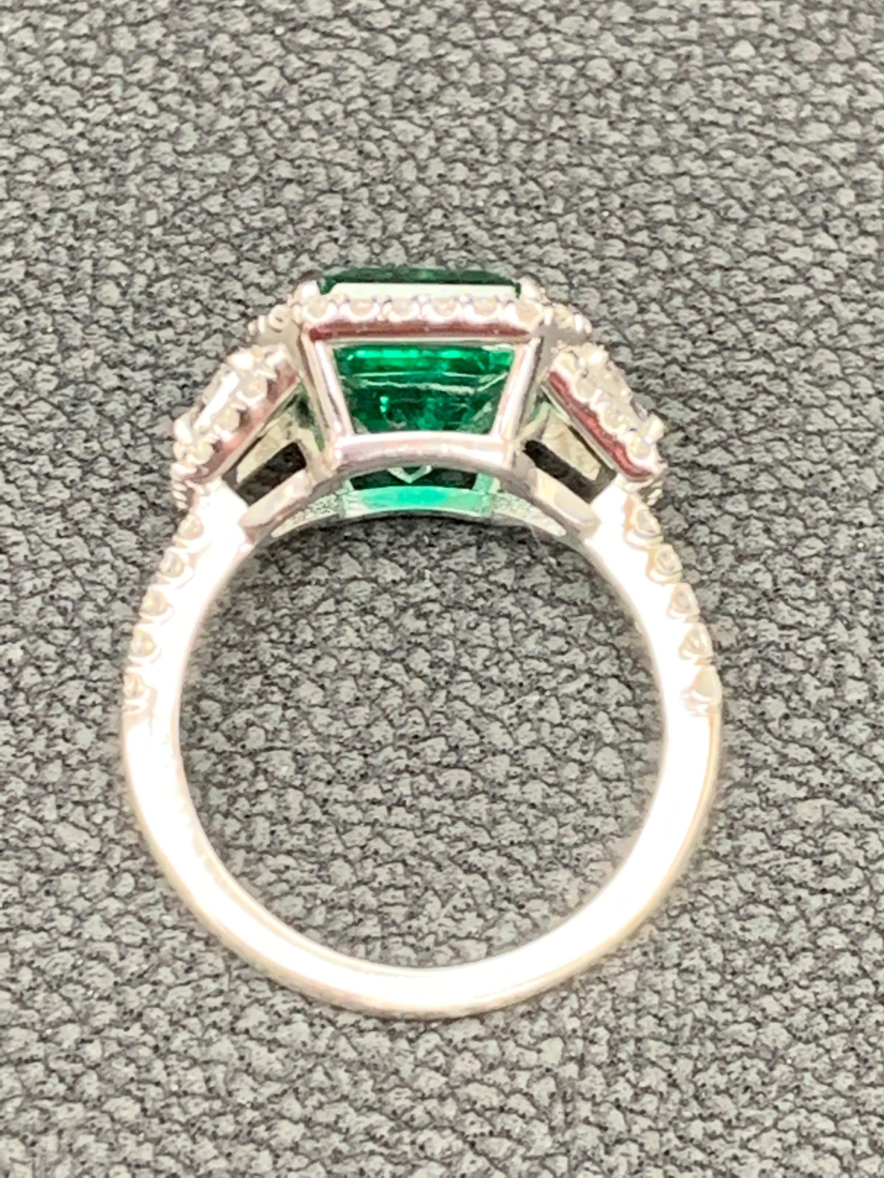 3.93 Carat Emerald Cut Emerald and Diamond Three-Stone Halo Ring in Platinum For Sale 5