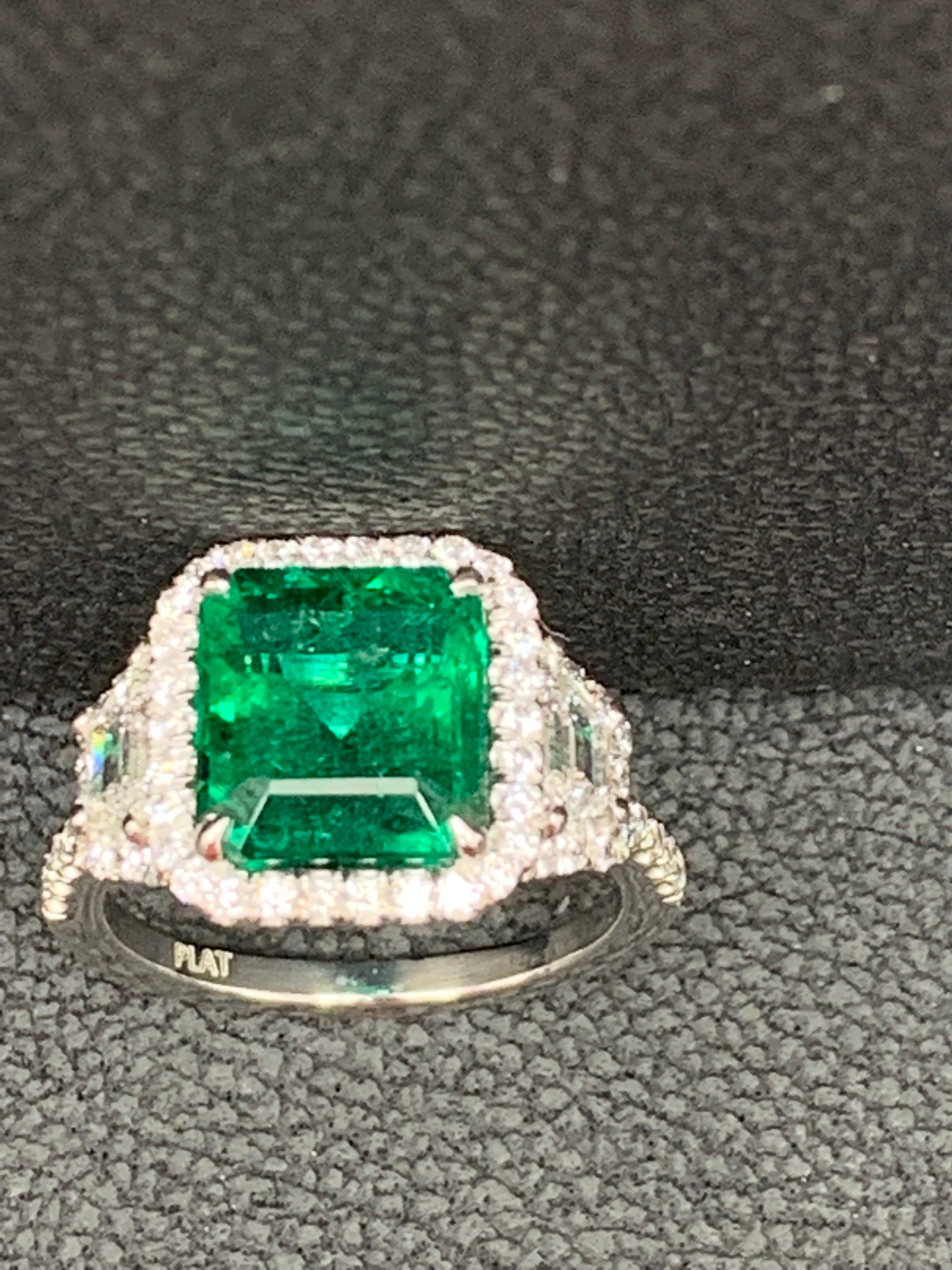 3.93 Carat Emerald Cut Emerald and Diamond Three-Stone Halo Ring in Platinum For Sale 6