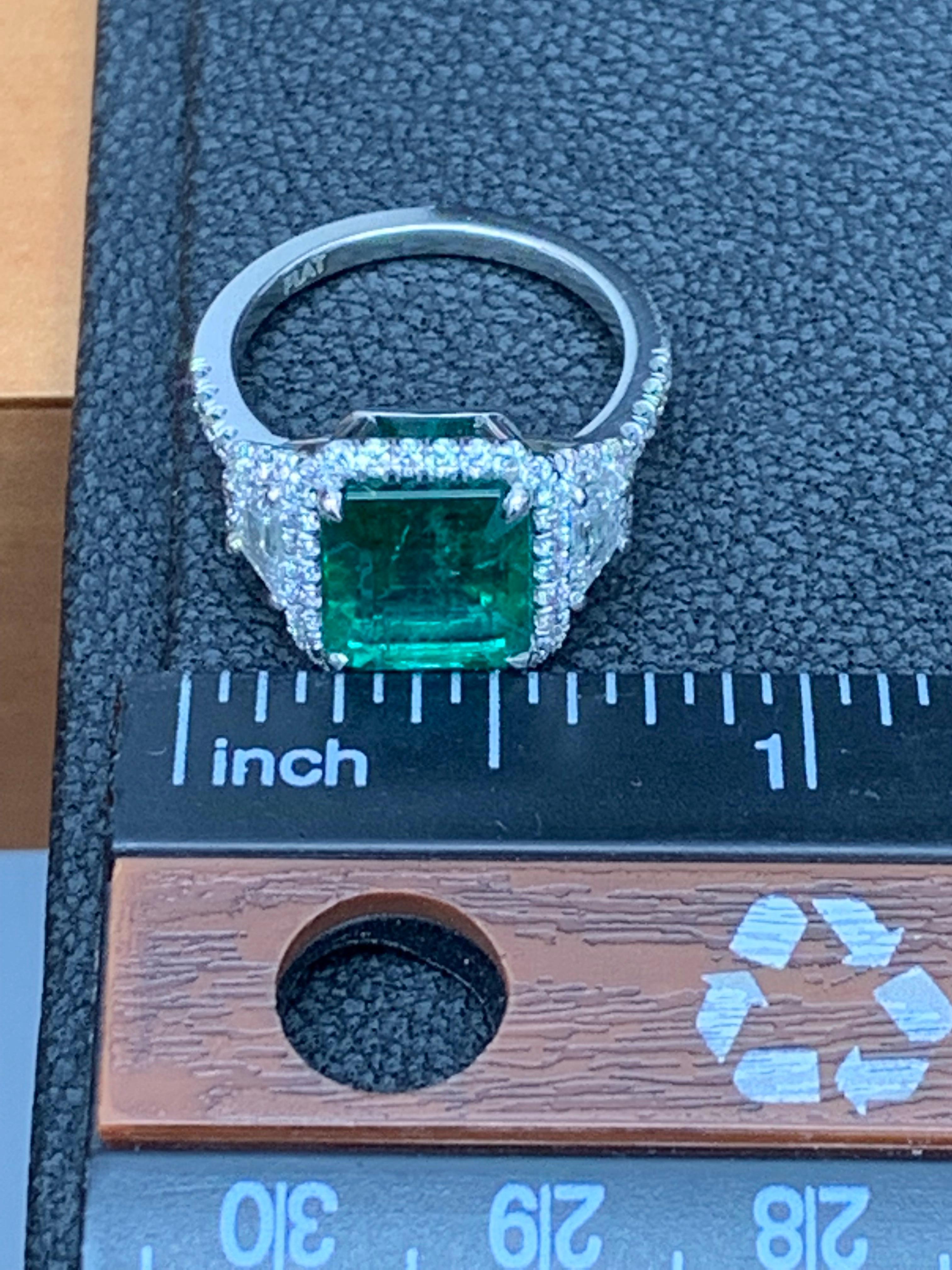 3.93 Carat Emerald Cut Emerald and Diamond Three-Stone Halo Ring in Platinum For Sale 7