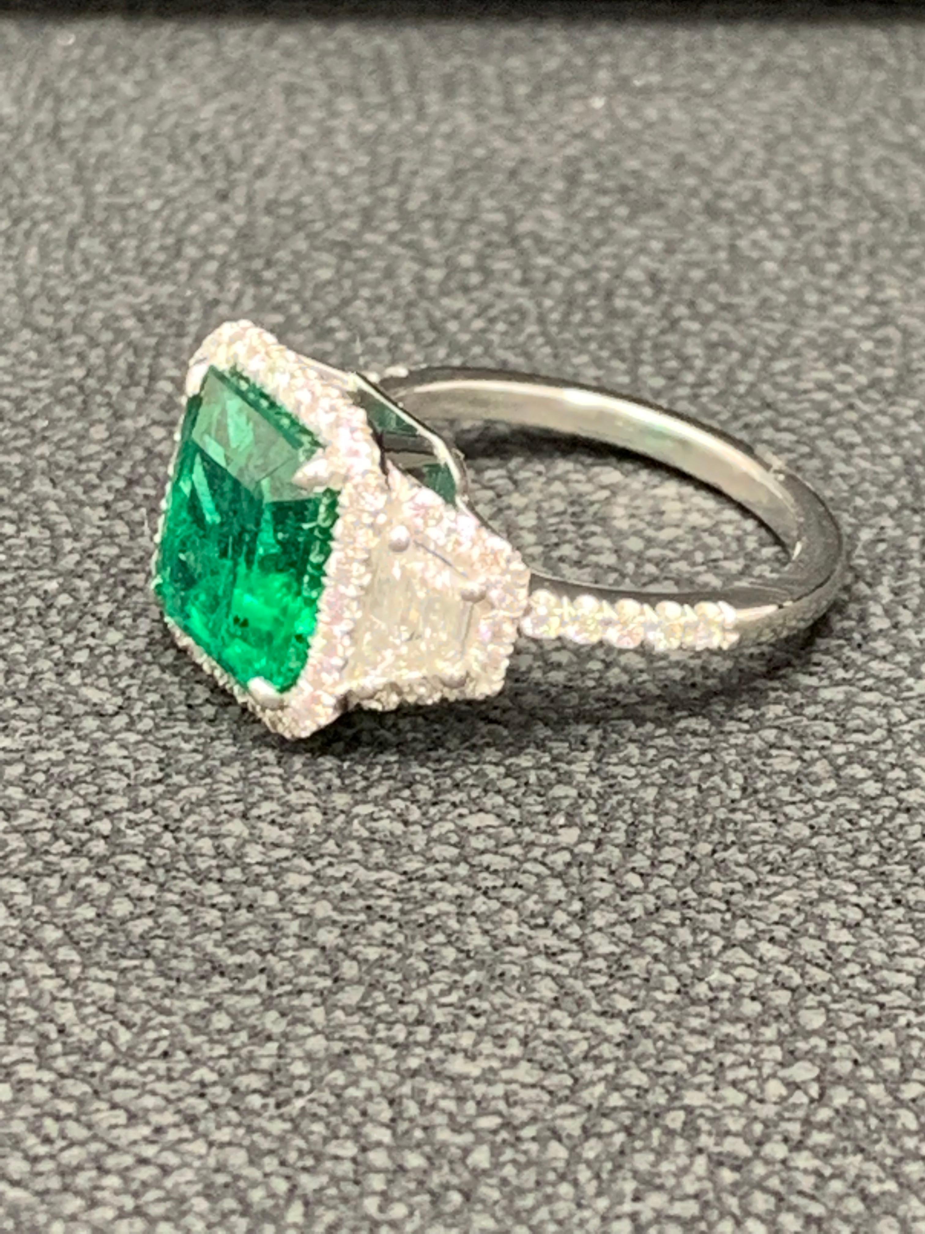 3.93 Carat Emerald Cut Emerald and Diamond Three-Stone Halo Ring in Platinum For Sale 2