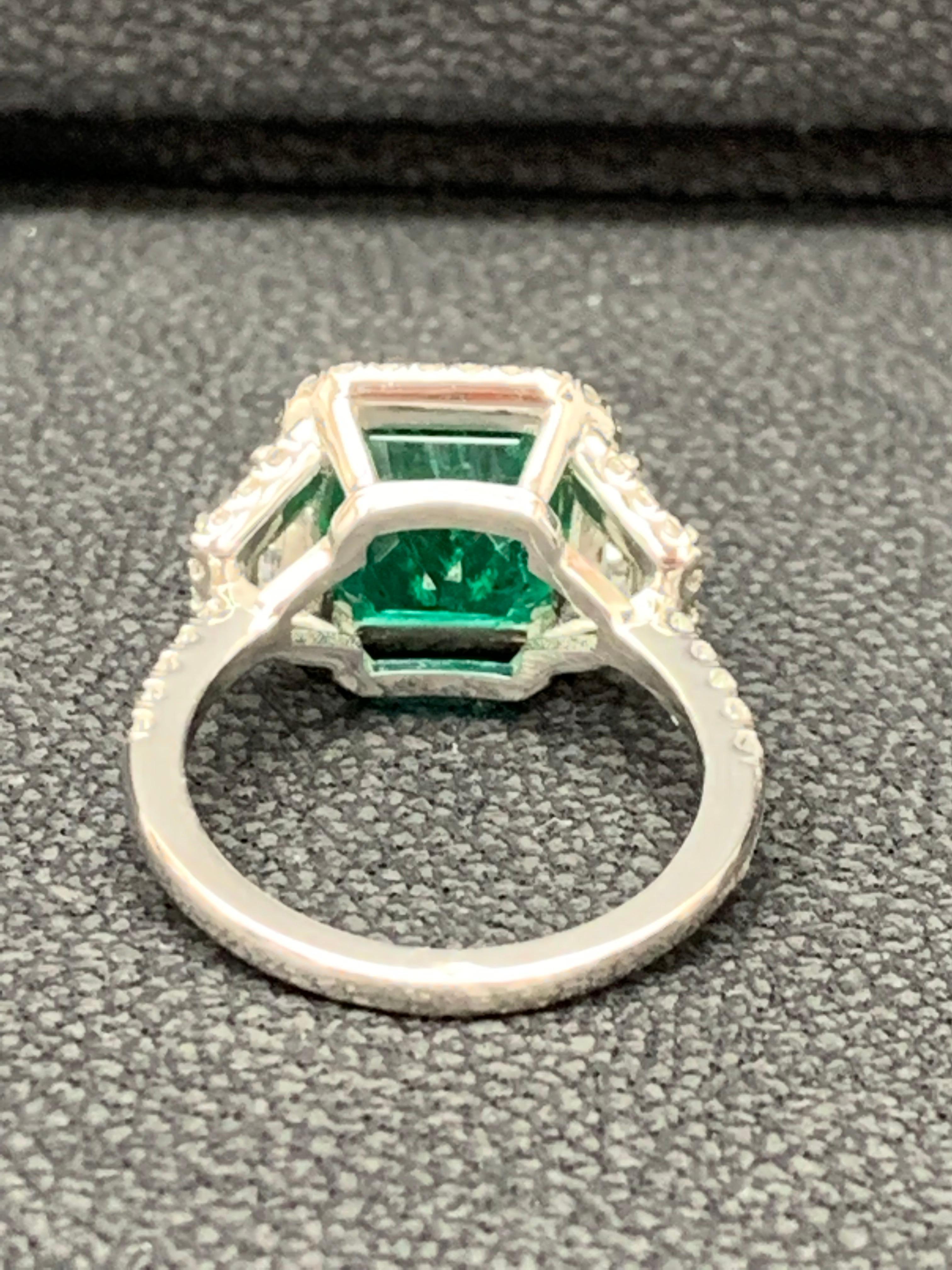 3.93 Carat Emerald Cut Emerald and Diamond Three-Stone Halo Ring in Platinum For Sale 4