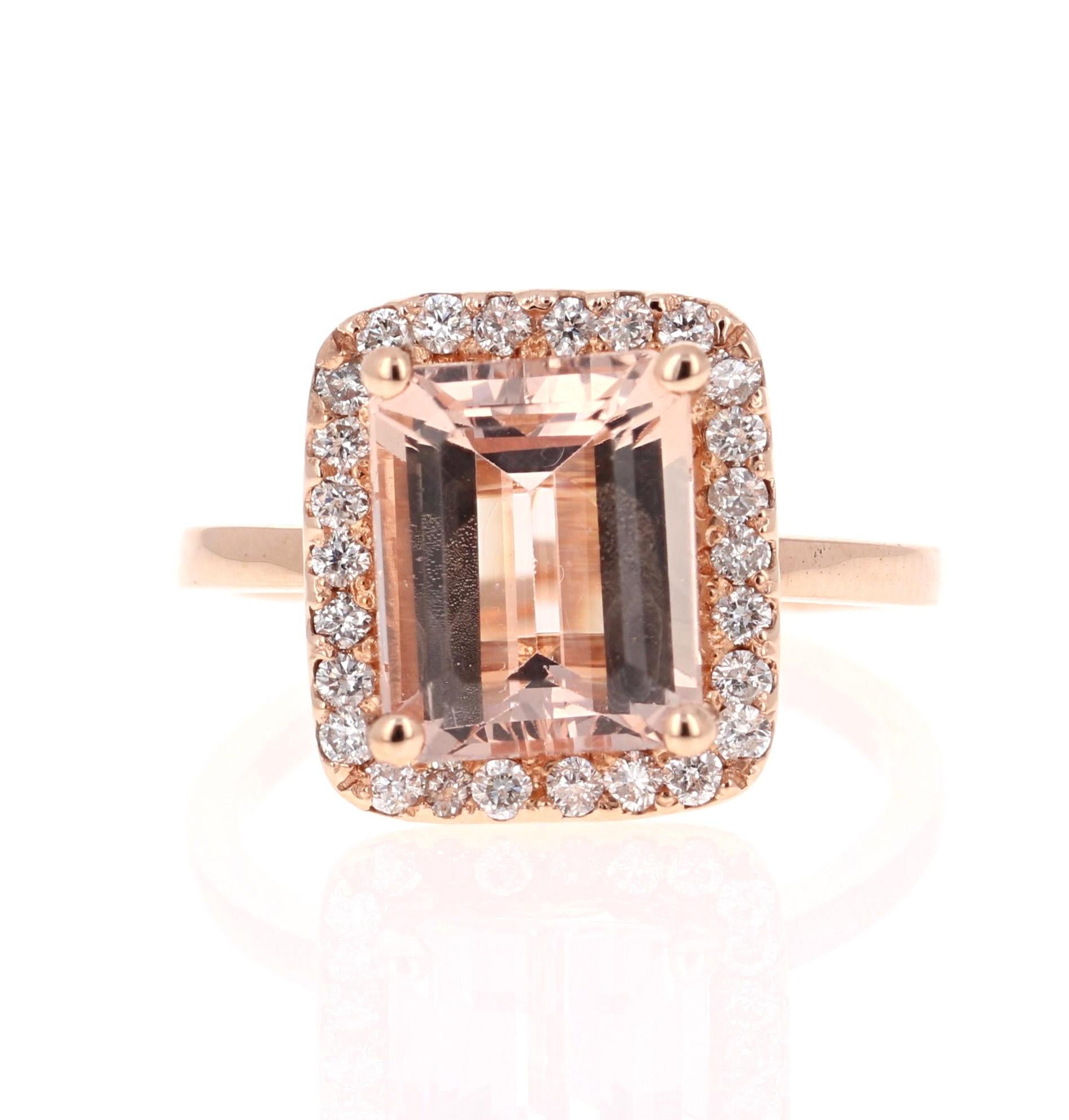 Statement Morganite Diamond Ring! 

This ring has a 3.51 Carat Emerald Cut Morganite and is surrounded by 26 Round Cut Diamonds that weigh 0.42 Carats. The total carat weight of the ring is 3.93 Carats.  

The Morganite is 12 mm x 10 mm and is