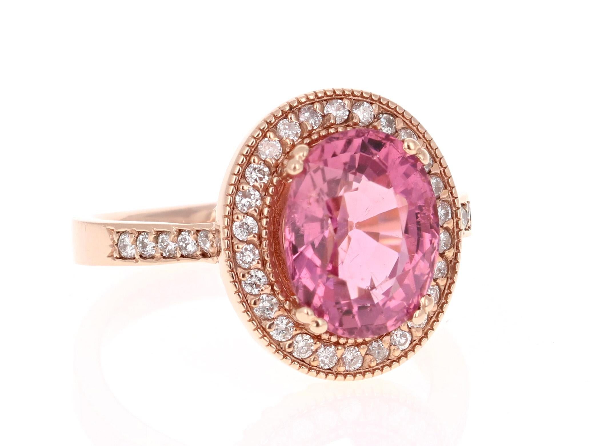 Wow! Beautiful and Radiant Pink Tourmaline Ring in a gorgeous Rose Gold Setting.

This ring has an Oval Cut Pink Tourmaline that weighs 3.59 Carats. Floating around the tourmaline are 36 Round Cut Diamonds weighing 0.34 Carats. 
The total carat