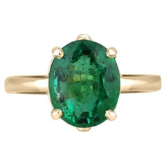 Anello solitario con smeraldo ovale verde scuro a quattro punte 585