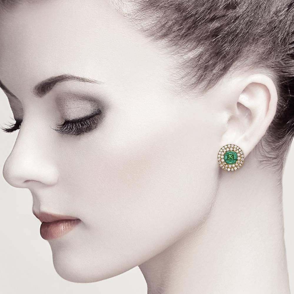 Luxurious Round Emerald and double row white diamond  Stud Earring will be you favorite jewelry piece. This earring is set in 18K yellow gold. 

Closure: Push Post 
18kt: 8.09gms
Diamond: 2.24cts H color VS2
Emerald: 3.93cts                         