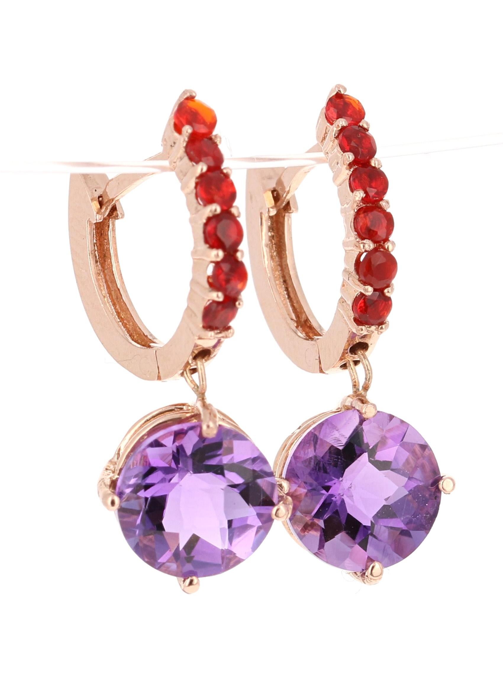 Amethyst and Fire Opal Drop Earrings! 

These stunning earrings have 2 Amethysts that weigh 3.62 Carats and are embellished with 12 Fire Opals that weigh 0.32 Carats. The total carat weight of the earrings are 3.94 Carats. 

They are beautifully set