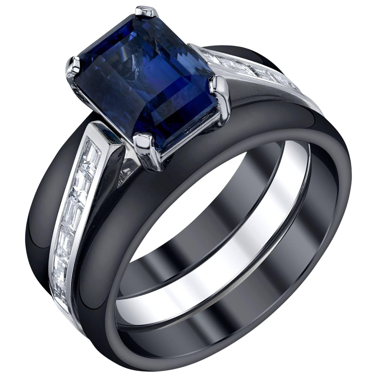 A rich, royal blue sapphire is set with twelve baguette diamonds in a stunning 18k white gold ring - part of our Sticks & Stones Collection. This ring includes 2 dramatic black ceramic bands for stacking. Handmade by our jewelers in Los