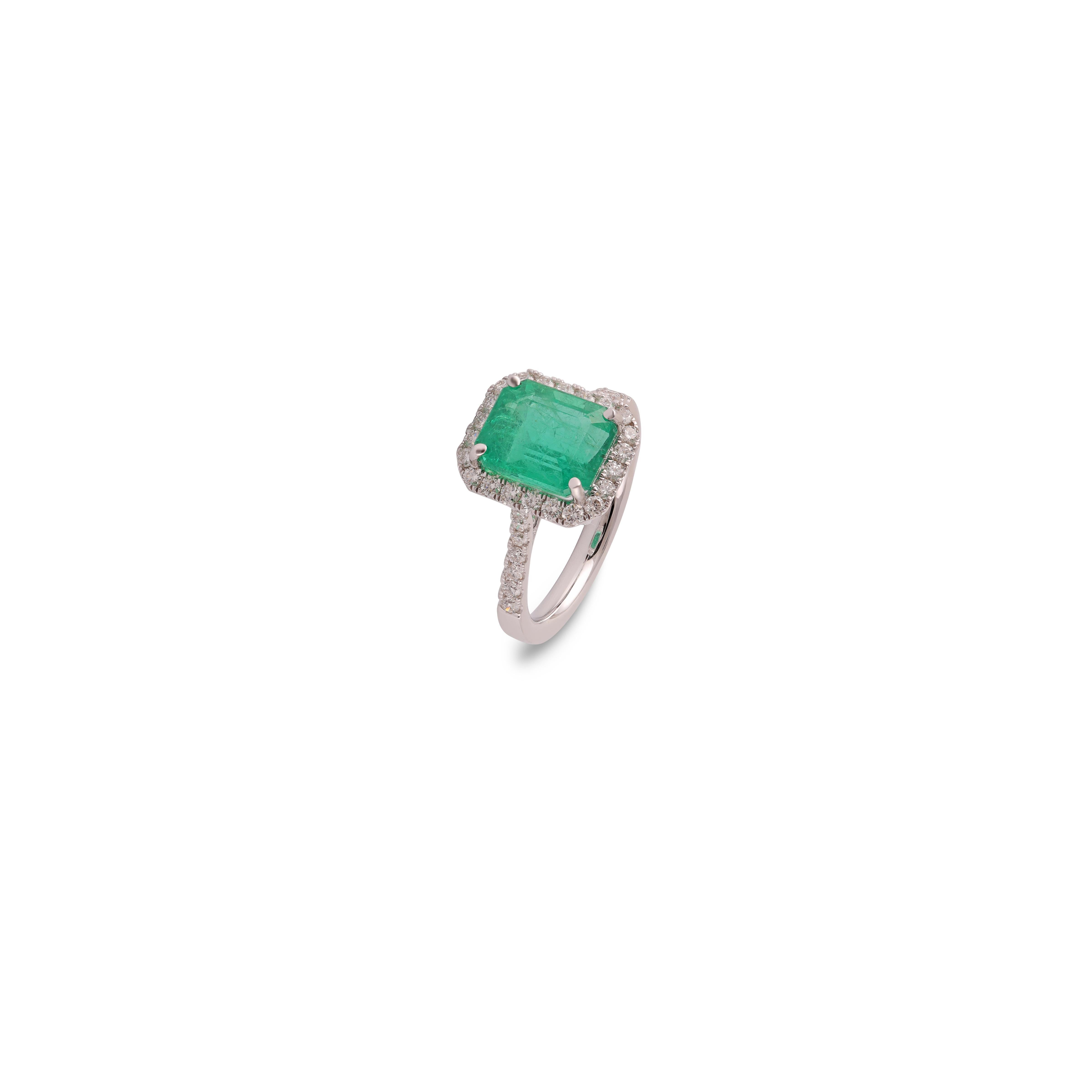 Emerald Cut 3.94 Carat Clear Zambian Emerald & Diamond Cluster Ring in 18Karat White Gold For Sale