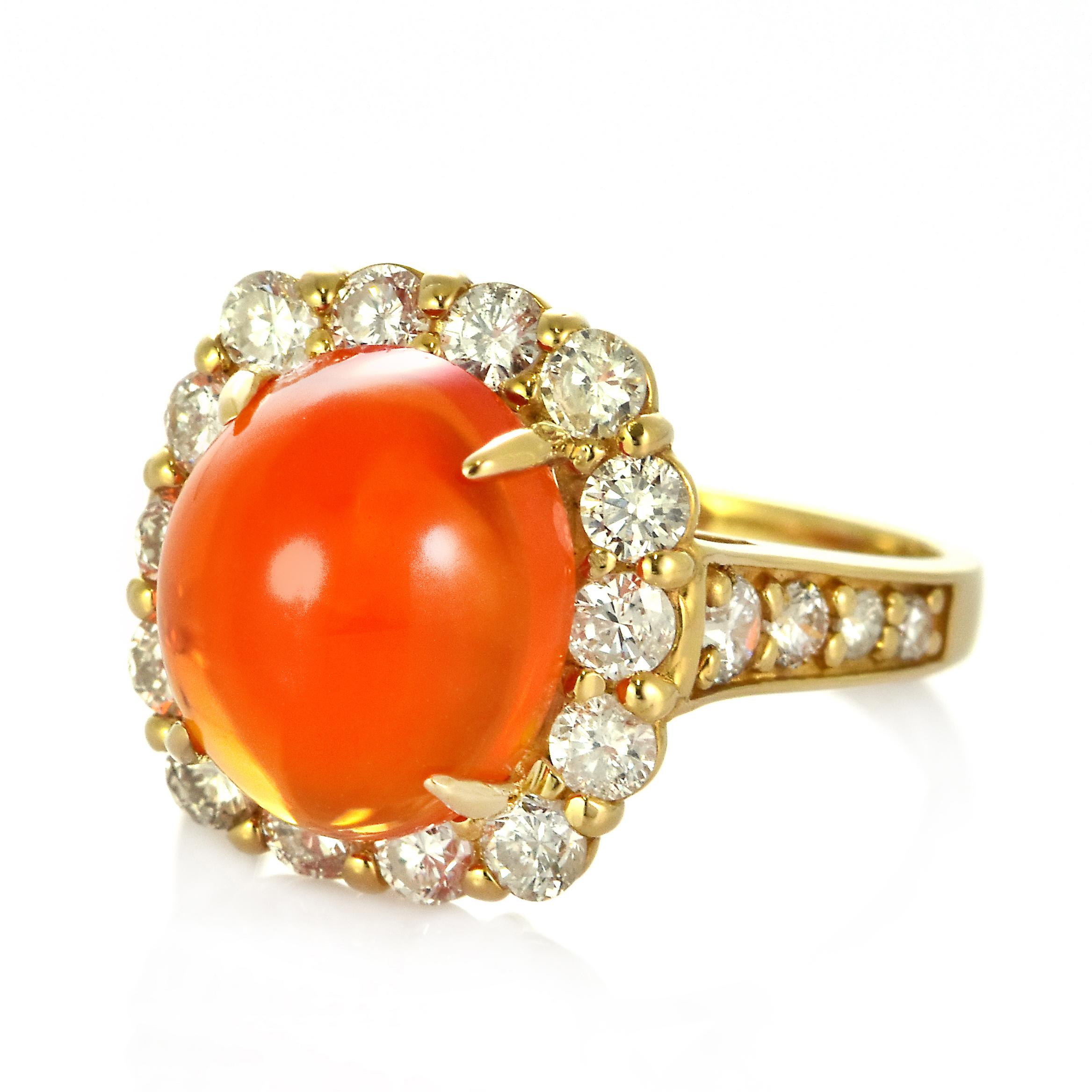 A beautiful ring featuring a 3.94 Carat Natural Fire Opal and 1.33 Carats of Diamond Accents set in 18 Karat Gold. Opals are known for exhibiting flashes of rainbow colors known as 
