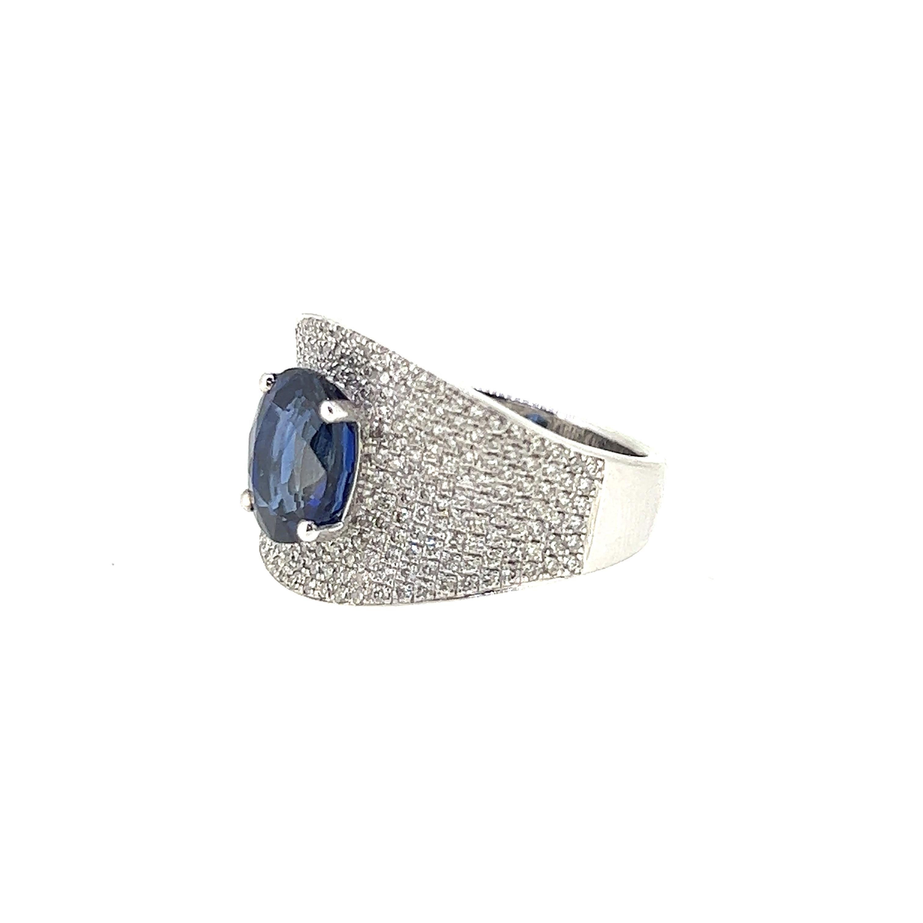Oval Cut 3.94 Carat Sapphire and Diamond Ring Set on 18 Karat White Gold For Sale