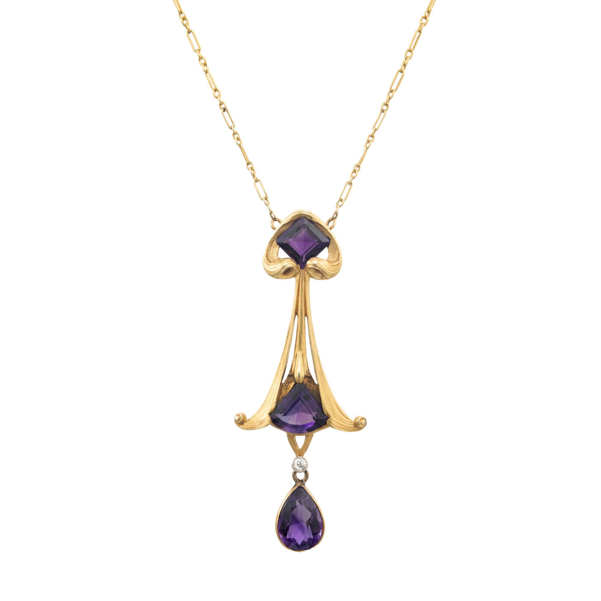 All original, Early 1930's 18k gold handmade, hand engraved front and back. Set with square purple amethyst with a total weight of .90cts. One triangular amethyst with a total weight of 1.25cts and one pear shaped amethyst with a total weight of