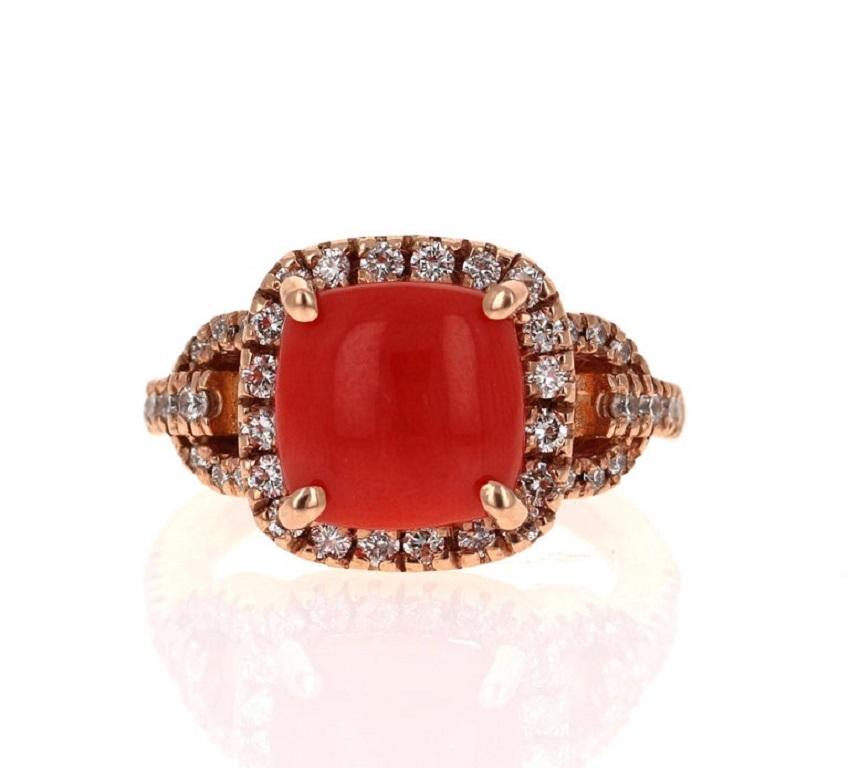 This one of a kind beauty has a magnificent 3.22 Carat Cushion Cut Coral and is further embellished with 42 Round Cut Diamonds that weigh 0.73 Carats (Clarity: VS2, Color: F).  The total carat weight of the ring is 3.95 carats.

The ring is made in