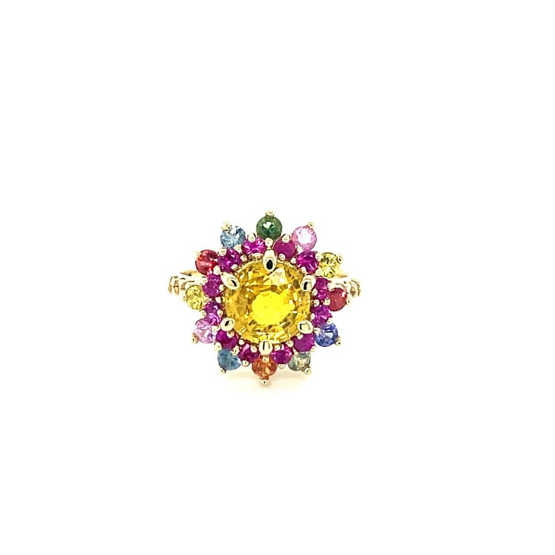 3.95 Carat Natural Yellow Multi Sapphire Diamond Yellow Gold Cocktail Ring

Item Specs:
Natural Round Cut Yellow Sapphire = 2.41 Carats
12 Natural Round Cut Pink Sapphires = 0.53 Carats
12 Natural Round Cut Multi-Colored Sapphires = 0.88 Carats
6
