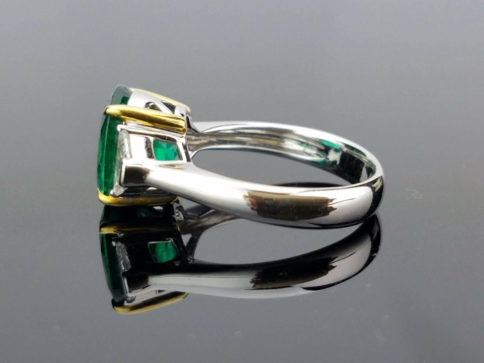 Modern 3.95 Carat Oval Emerald and Diamond Three-Stone Ring