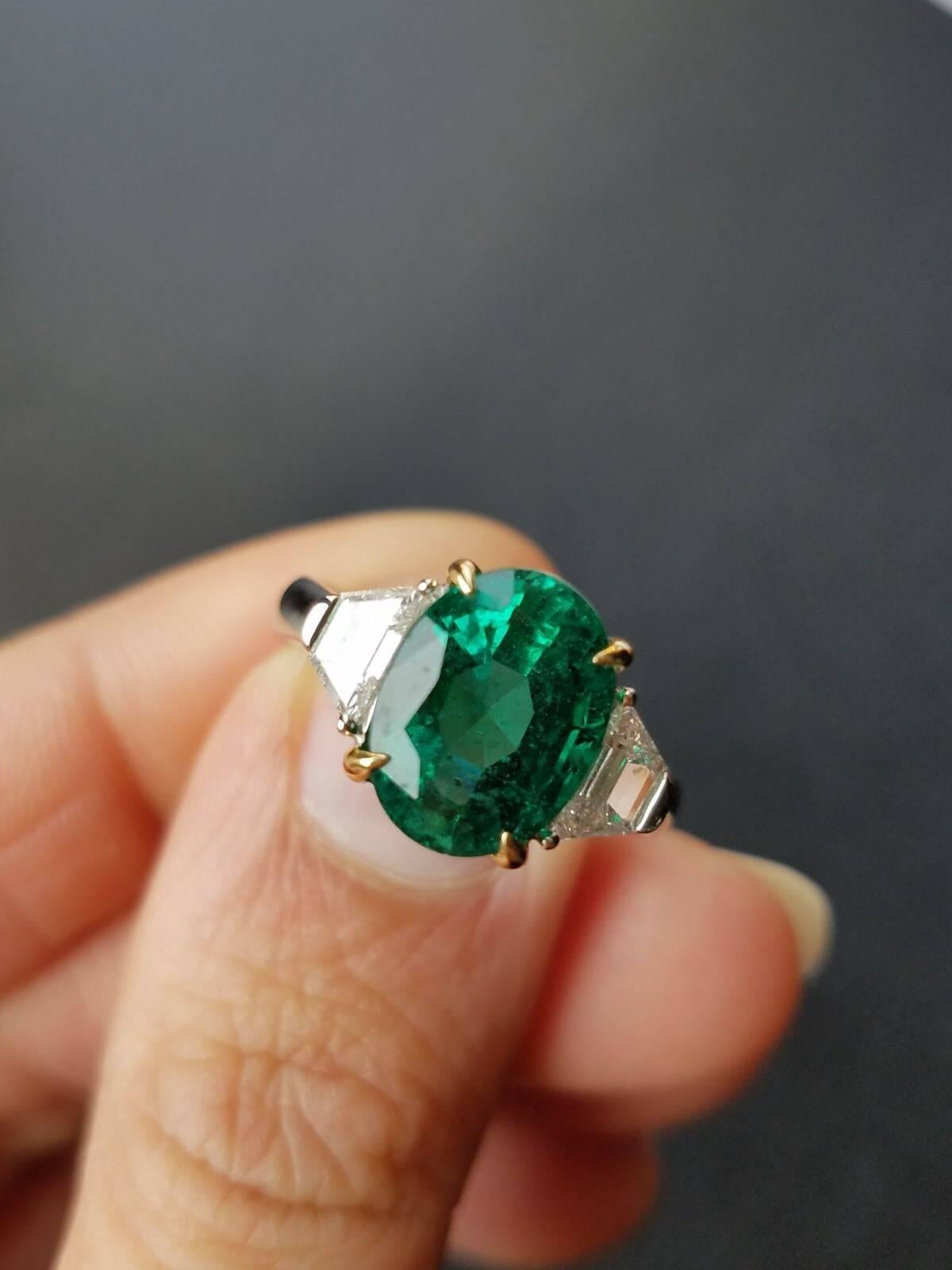 Oval Cut 3.95 Carat Oval Emerald and Diamond Three-Stone Ring
