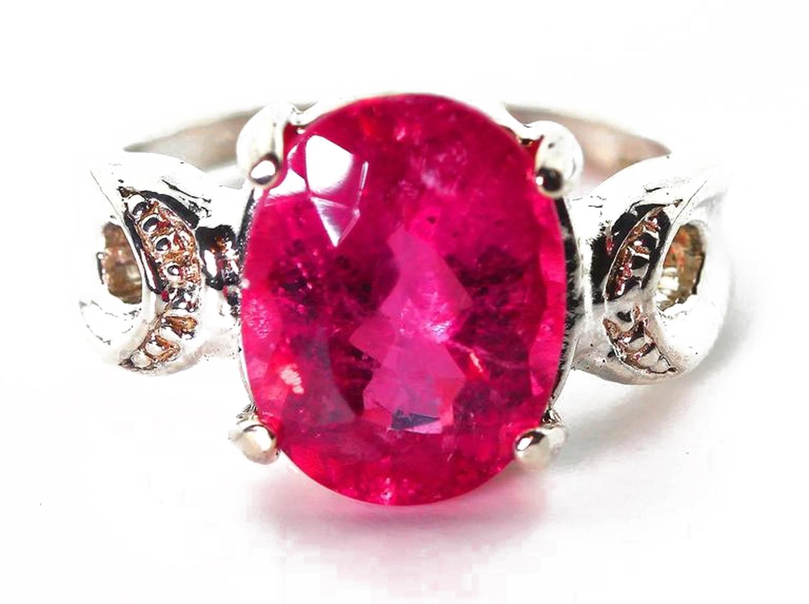 Sparkling glittering 3.95 Carats of oval Tourmaline.  This rare and unique beautiful color is between Pink and Magenta Brilliant with NO visible inclusions or white marks whatsoever ! !
Size:  11.75 mm x 8.9 mm
Ring:  Handmade in Sterling