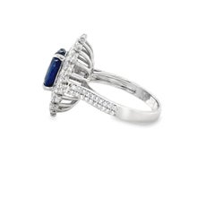 3.95 Carat Royal Blue Oval Sapphire & Diamond Cluster Ring