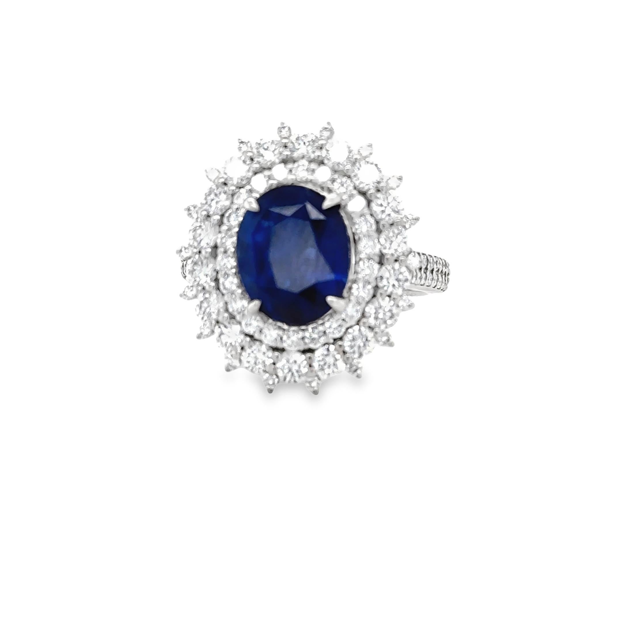 3.95 Carat Royal Blue Oval Sapphire & Diamond Cluster Ring In Excellent Condition For Sale In London, GB