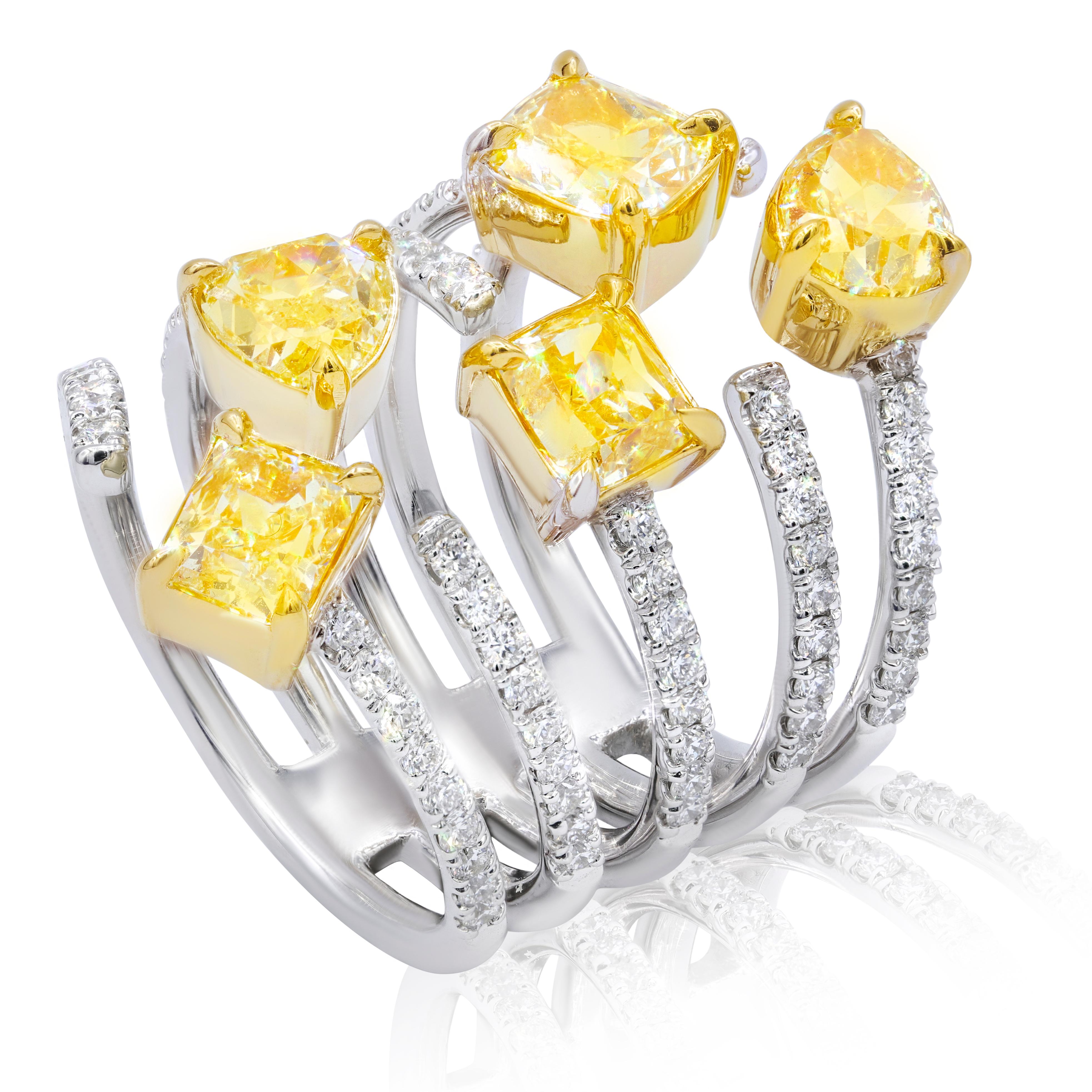 18KT two tone multi shaped fancy yellow diamond ring with 3.95 carats of five yellow diamonds and 0.90 carats micro pave diamonds.
Ring size: 6.5
Can be resized to any finger size.

This product comes with a certificate of appraisal
This product
