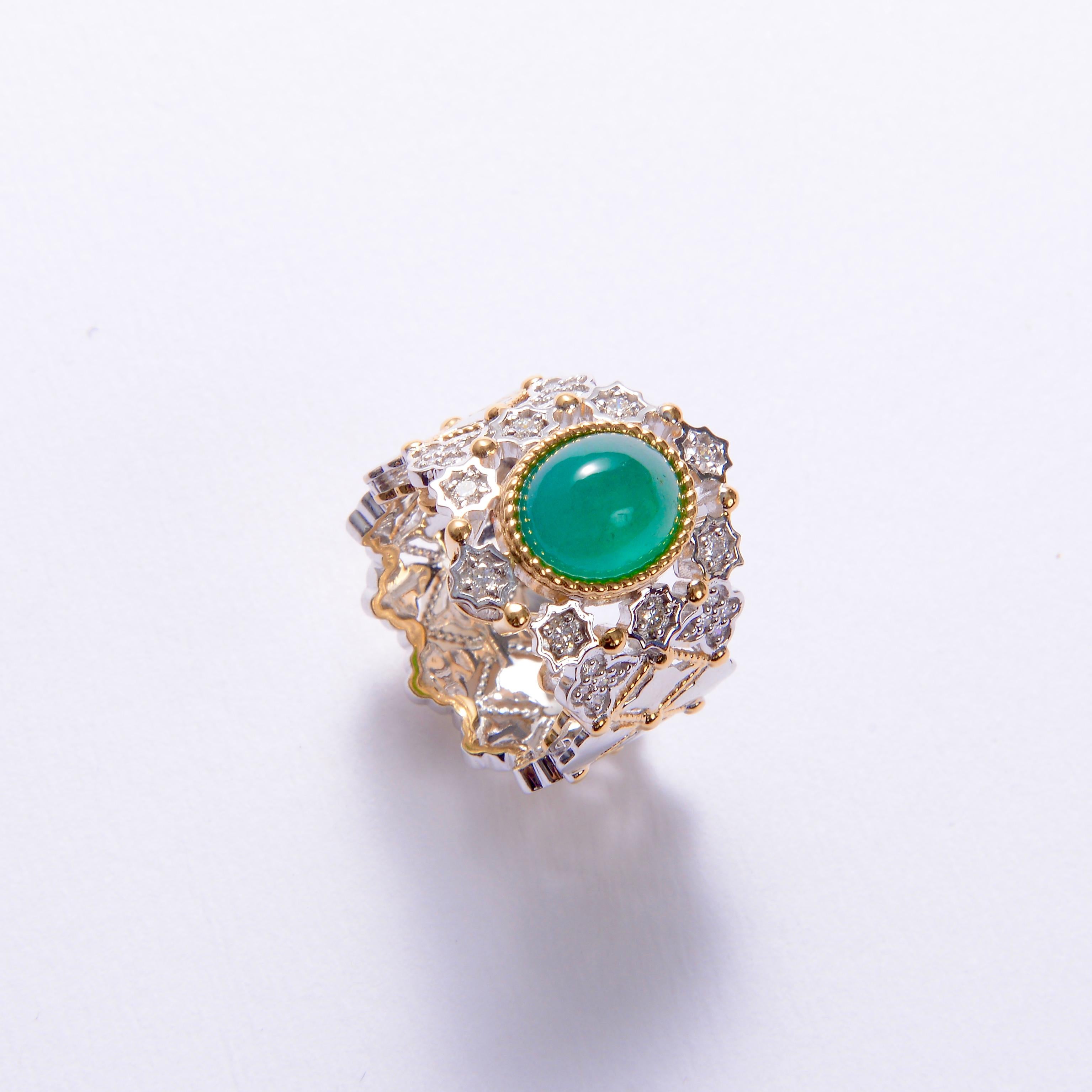 A 3.95 ct Vivid Green Colour Emerald and Diamond Ring in 18k Yellow and White Gold 
It consists of A Oval Shape Cabochon Emerald, With Insignificant Clarity Enhancement 
Total Natural Diamond weight is 0.44 ct , The Colour of the Diamond is