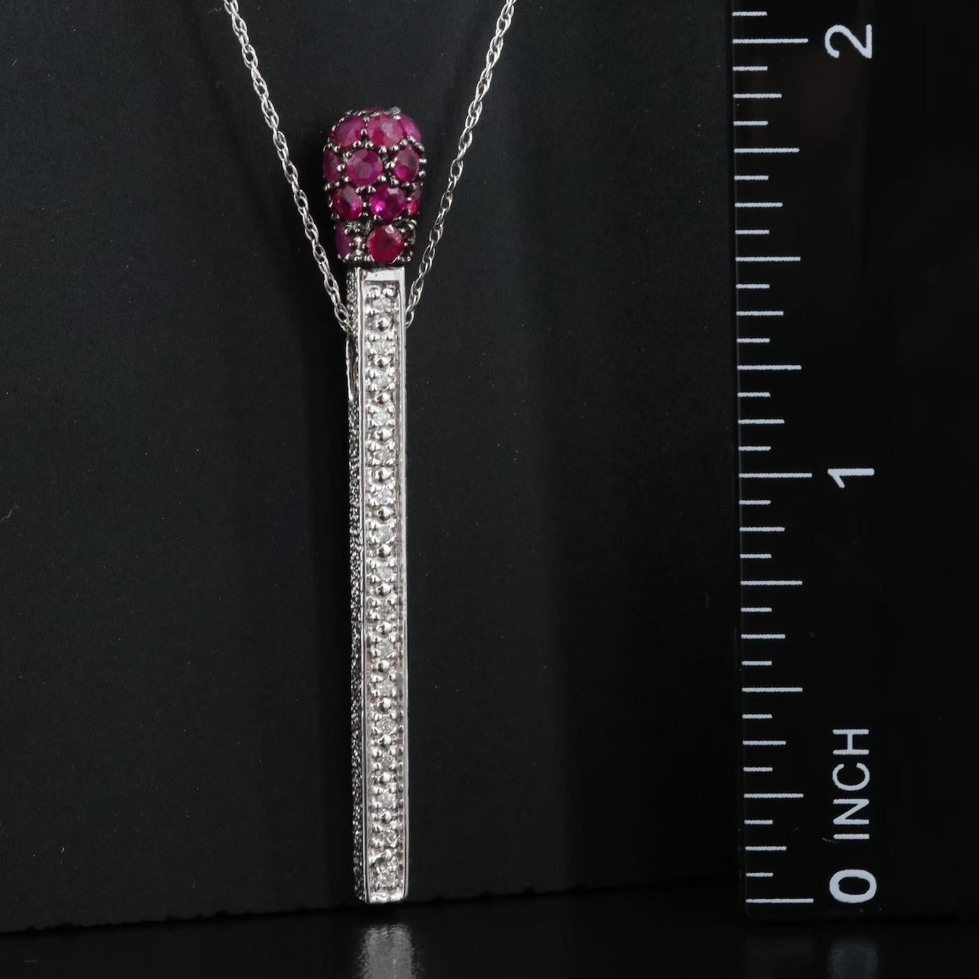Designer Necklace, stamped and hallmarked 14K JCR (John C Rinker)

NEW with Tags, Tag price $3950

1.05 CWT Natural Diamond & Natural Ruby, TOP QUALITY      

14K White Gold, stamped 14K

About 2 inches in drop length

3D Matchstick fancy design,