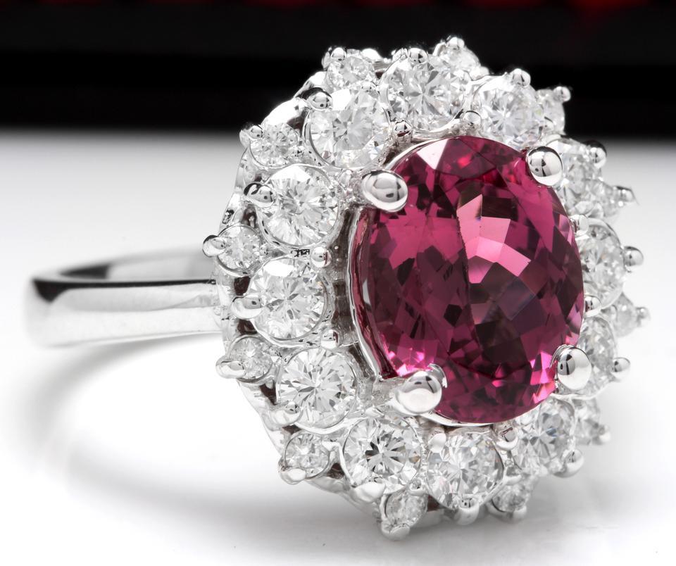 3.95 Carats Natural Very Nice Looking Pink Tourmaline and Diamond 14K Solid White Gold Ring

Total Natural Oval Cut Tourmaline Weight is: Approx. 2.60 Carats 

Tourmaline Treatment: Heat

Tourmaline Measures: Approx. 9.60 x 7.50mm

Natural Round