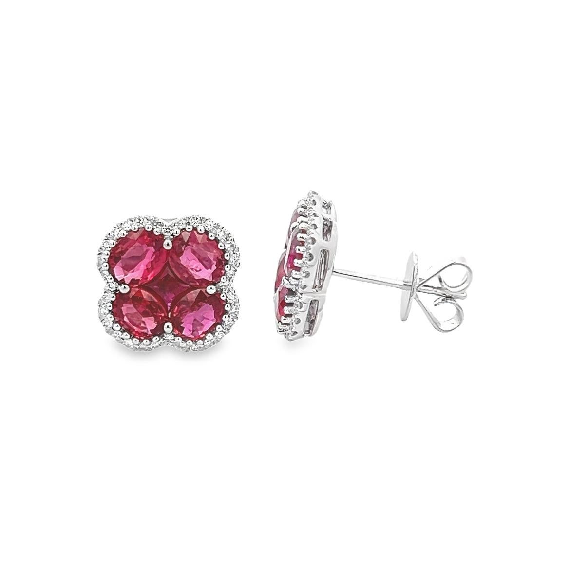 This wonderful pair of earrings are made of Natural Rubies and a Good Quality of  Earthborn Diamonds summarizing the pair beauty, set in polished 18K White Gold setting making this pieces an excellent accessory that can be used in a any occasion of