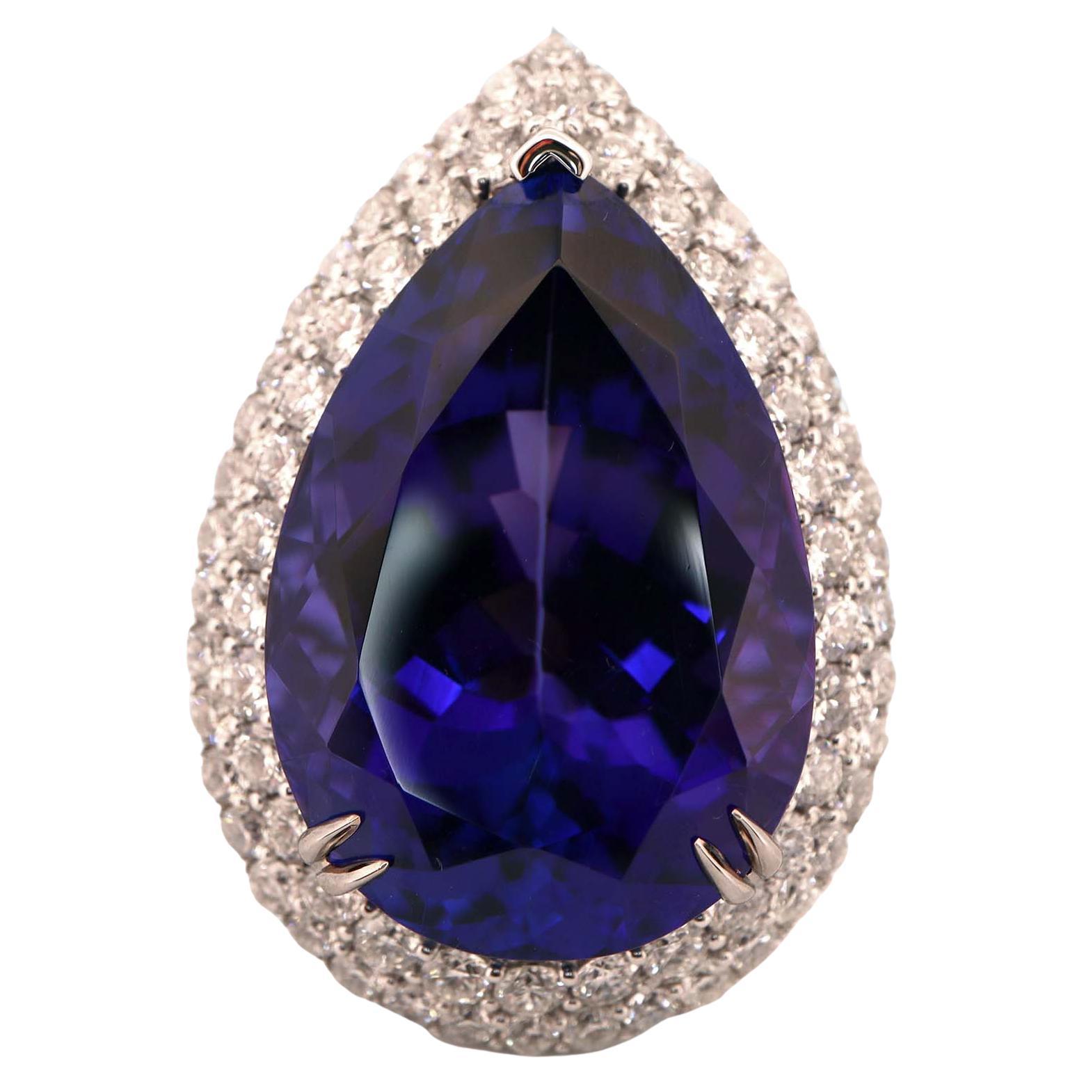 GIA Certified 39.6 Carat Tanzanite and 3.27 Carat Diamond Ring For Sale