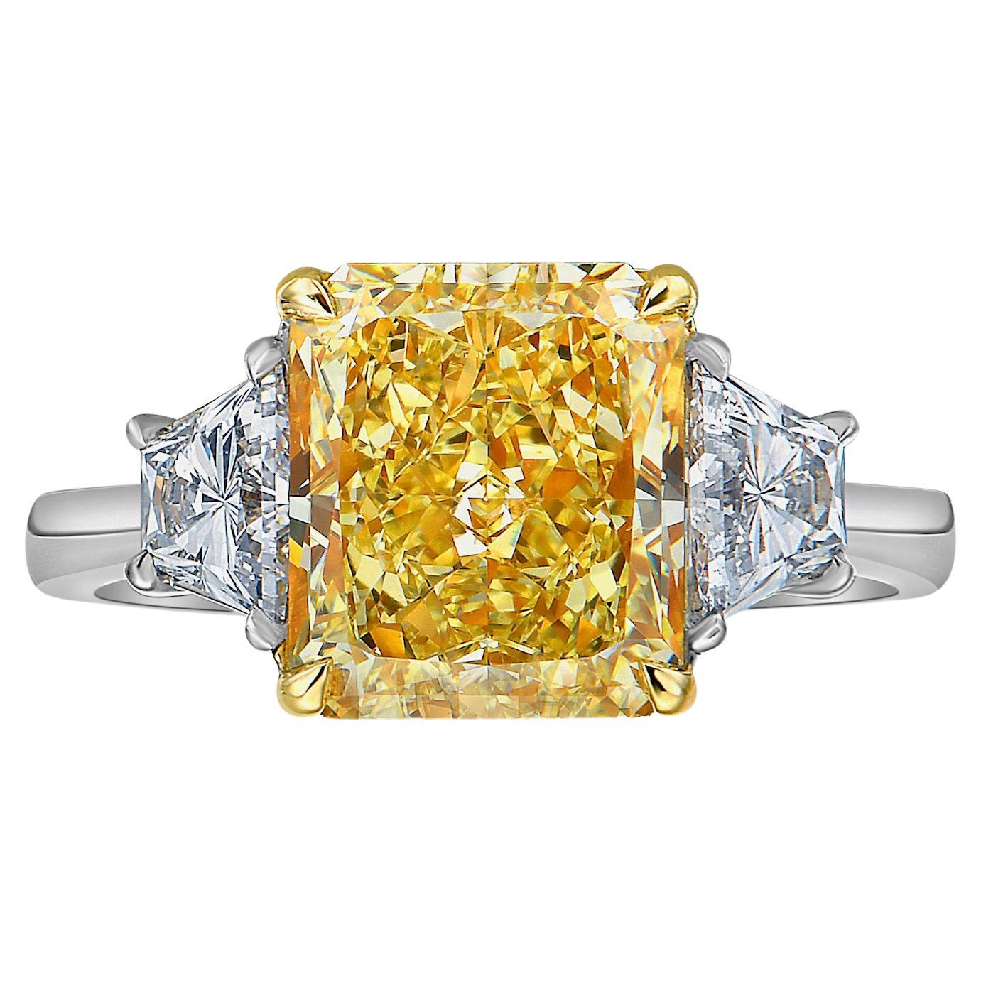 3.96ct GIA Fancy Yellow Radiant Diamond Three Stone Ring For Sale